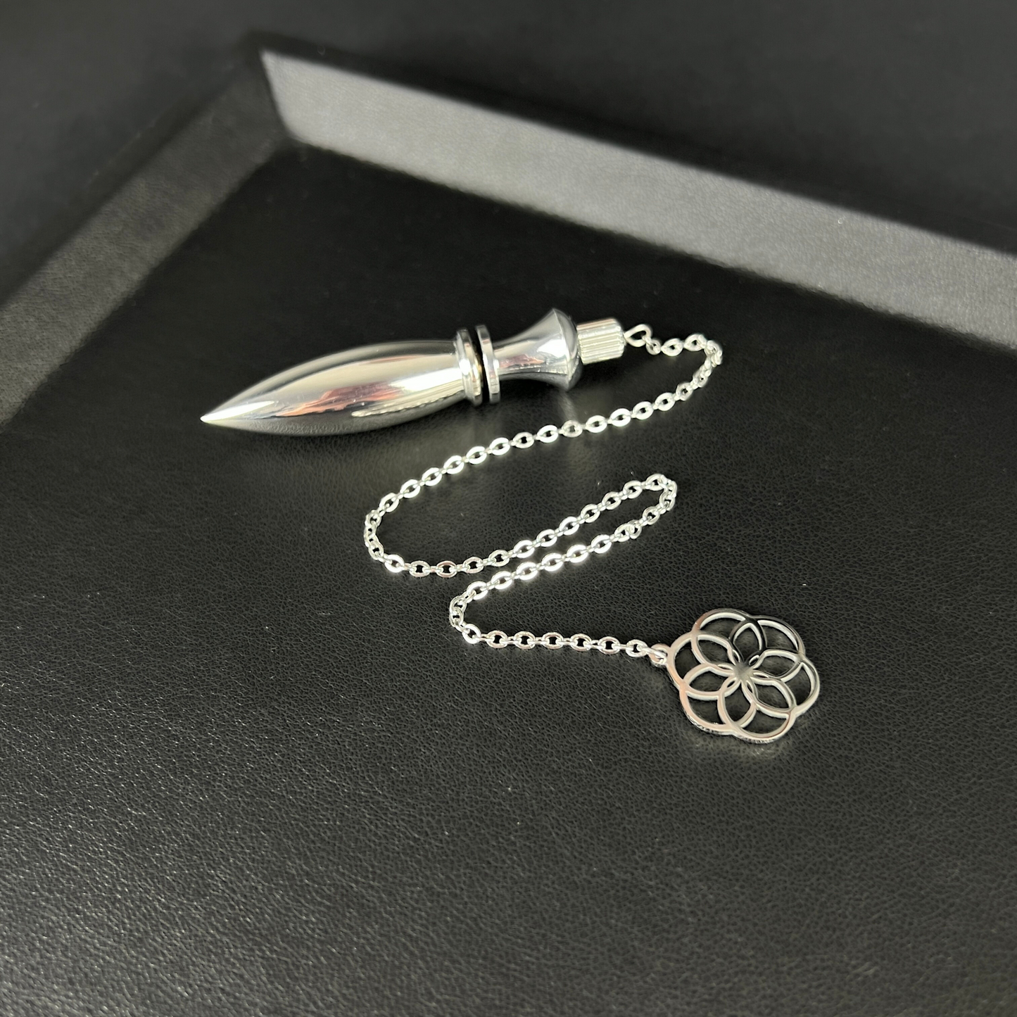 Metal Thot pendulum with a flower of life symbol Baguette Magick