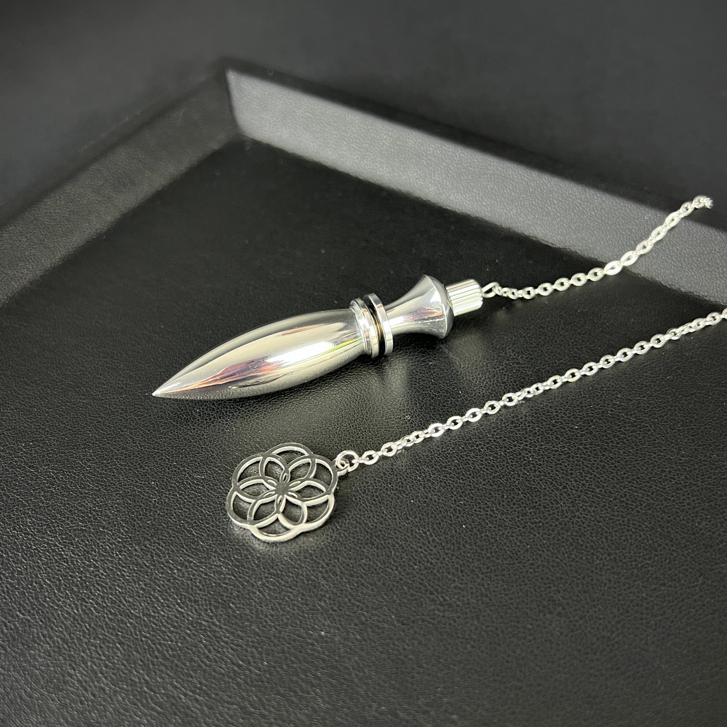 Metal Thot pendulum with a flower of life symbol Baguette Magick