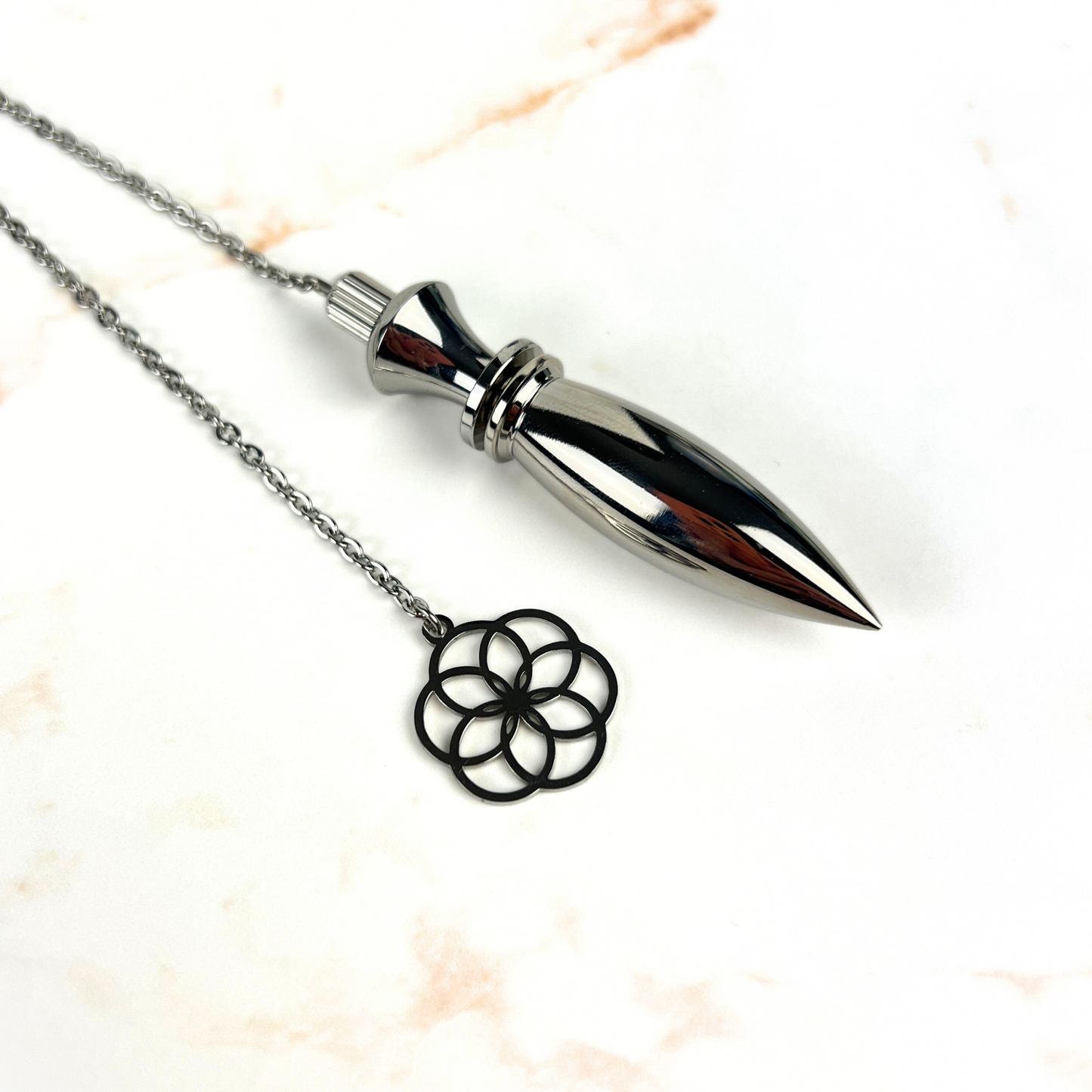 Metal Thot pendulum with a flower of life symbol Baguette Magick