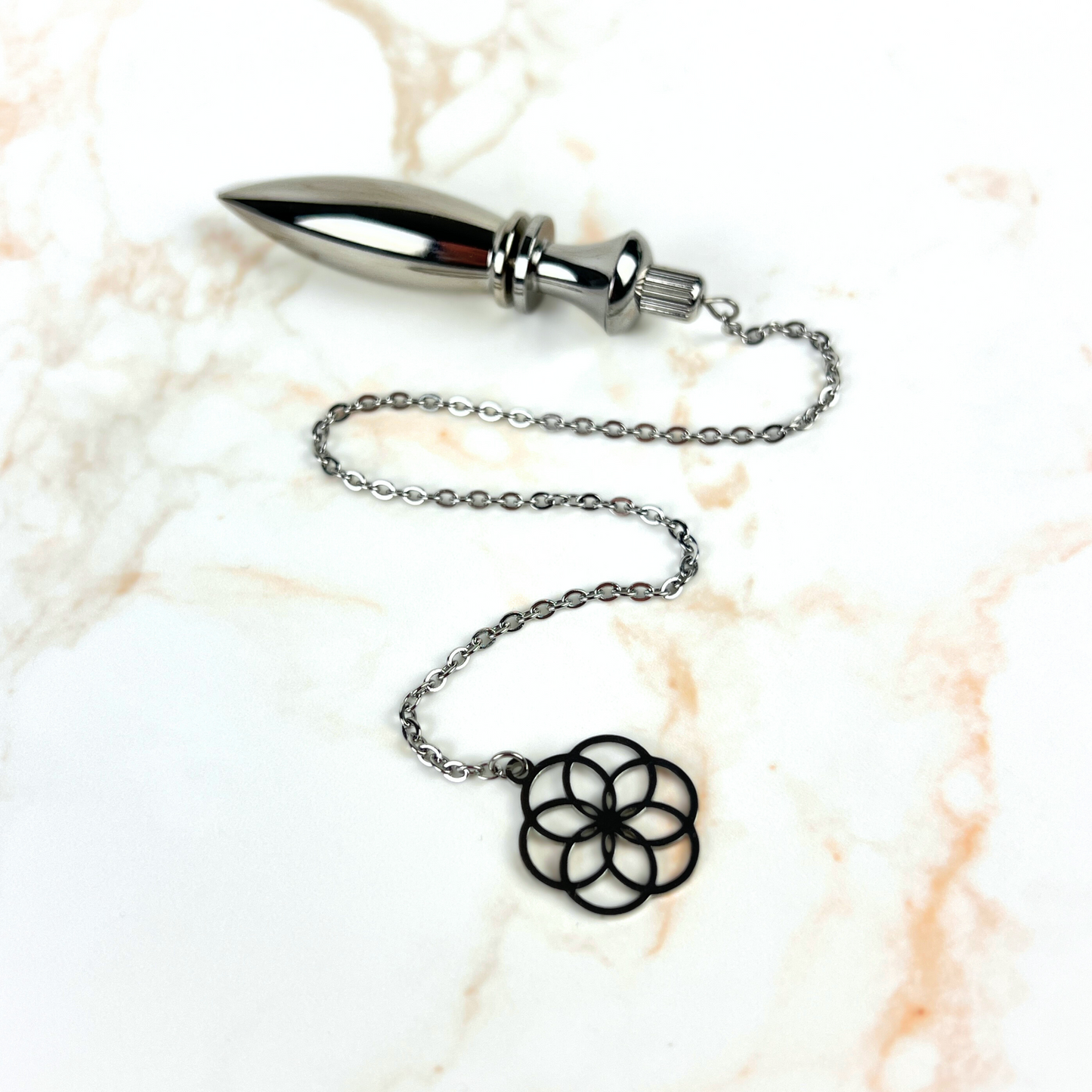 Metal Thot pendulum with a flower of life symbol Baguette Magick