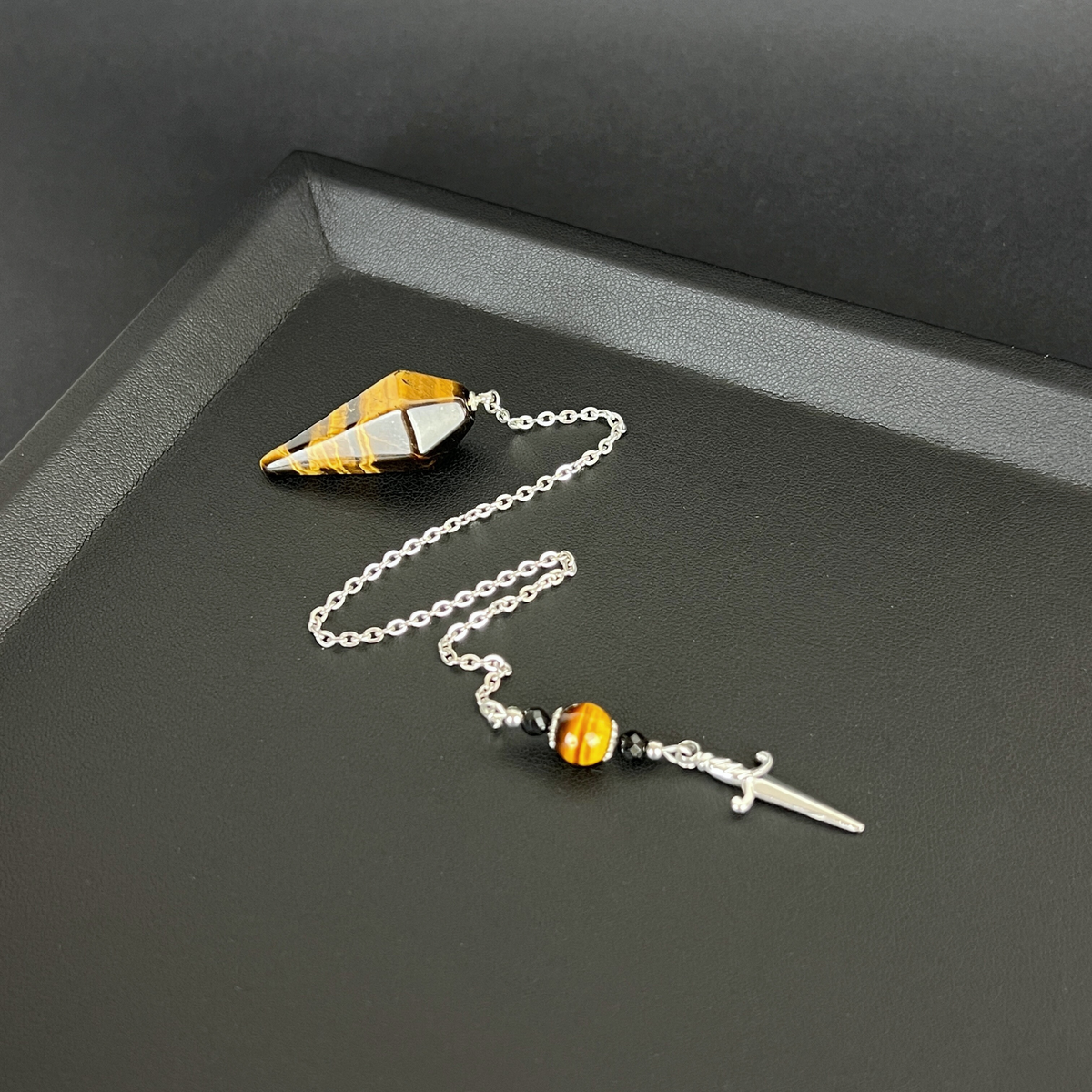 The athame pendulum, Tiger Eye, Onyx, stainless steel Baguette Magick