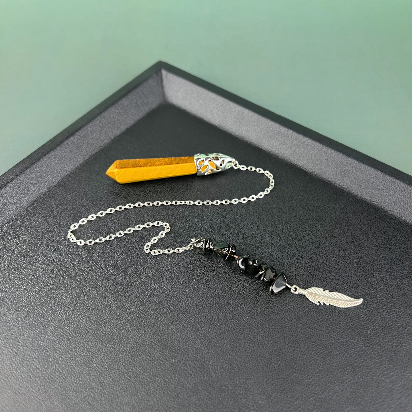 Tiger eye, obsidian and feather pendulum Baguette Magick
