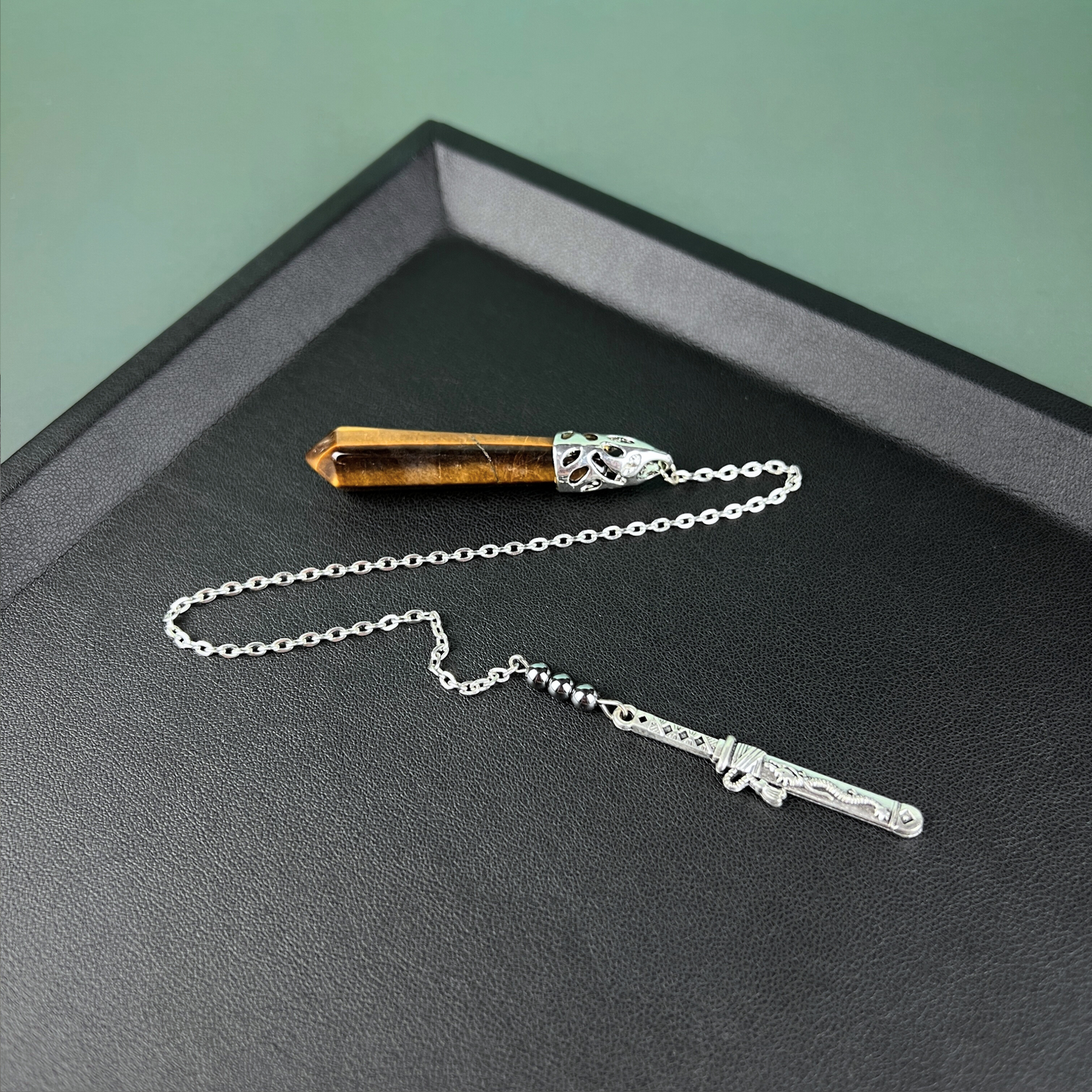 Tiger eye, hematite and tanto dagger pendulum Baguette Magick