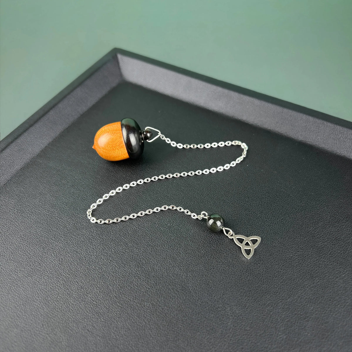 Acorn chamber pendulum, Ebony, Rainbow Obsidian and stainless steel Baguette Magick