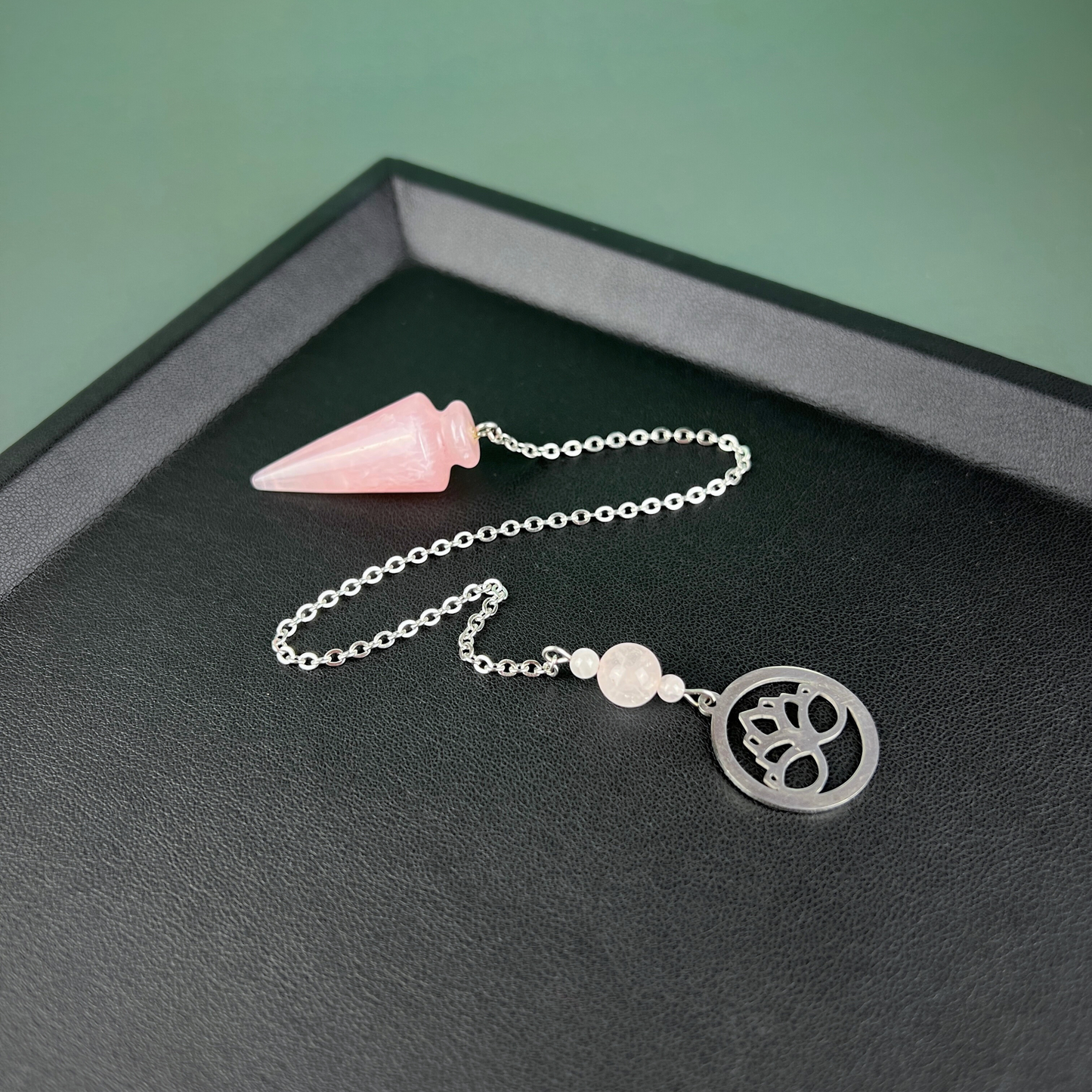 Rose quartz and stainless steel lotus flower pendulum Baguette Magick