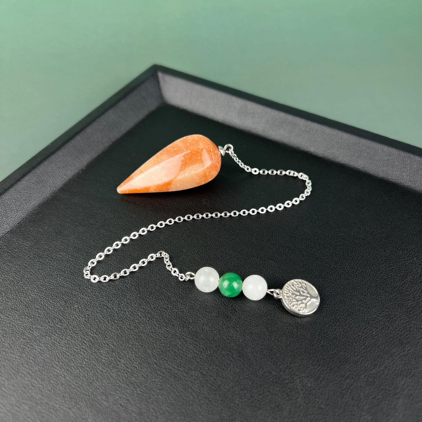 Orange and green aventurine, clear quartz, and tree of life stainless steel pendulum Baguette Magick