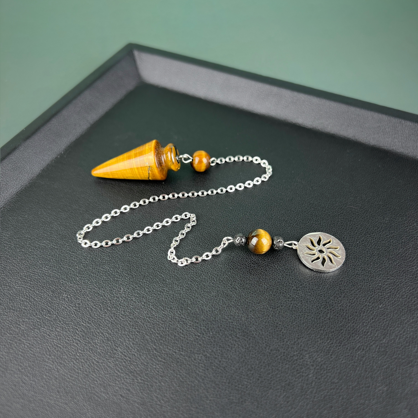 Tiger eye and stainless steel pendulum with a Sun charm Baguette Magick