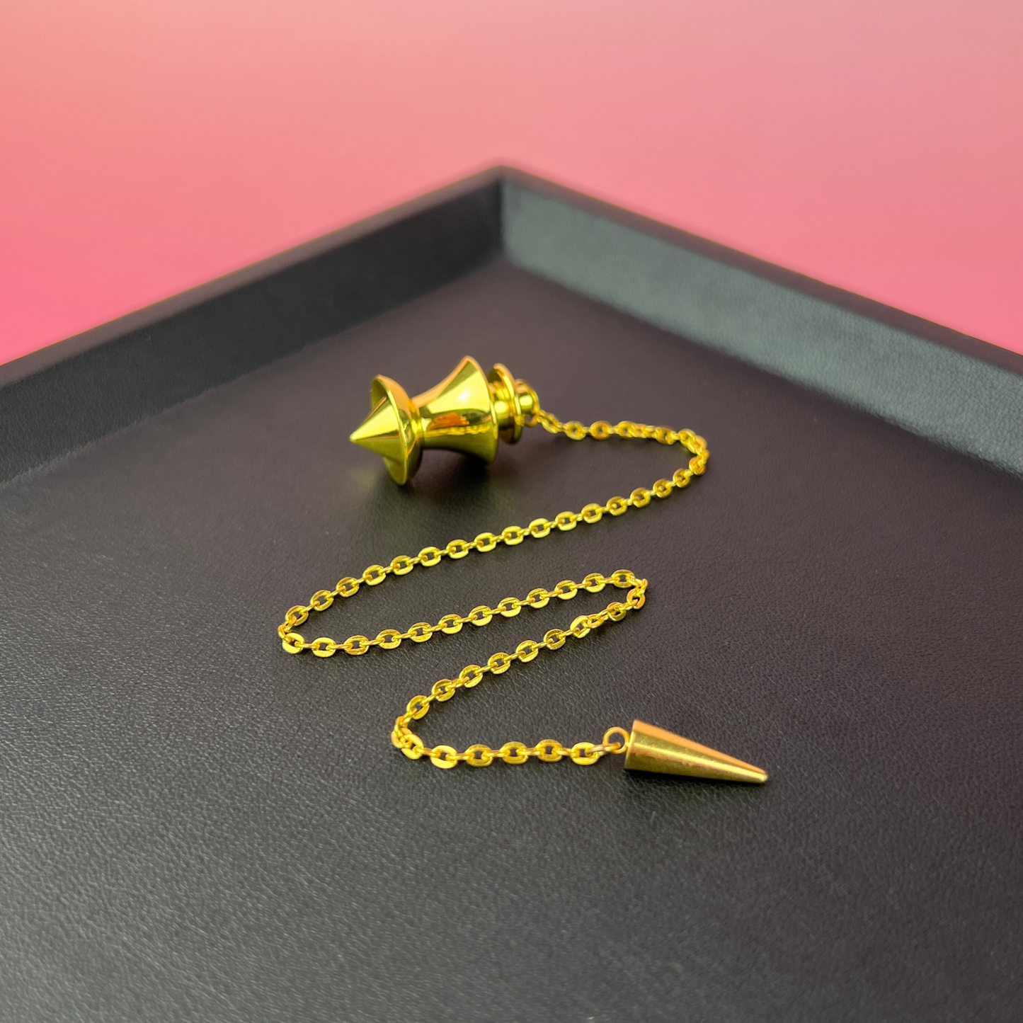Golden point and dome dowsing metal pendulum with a spike charm Baguette Magick