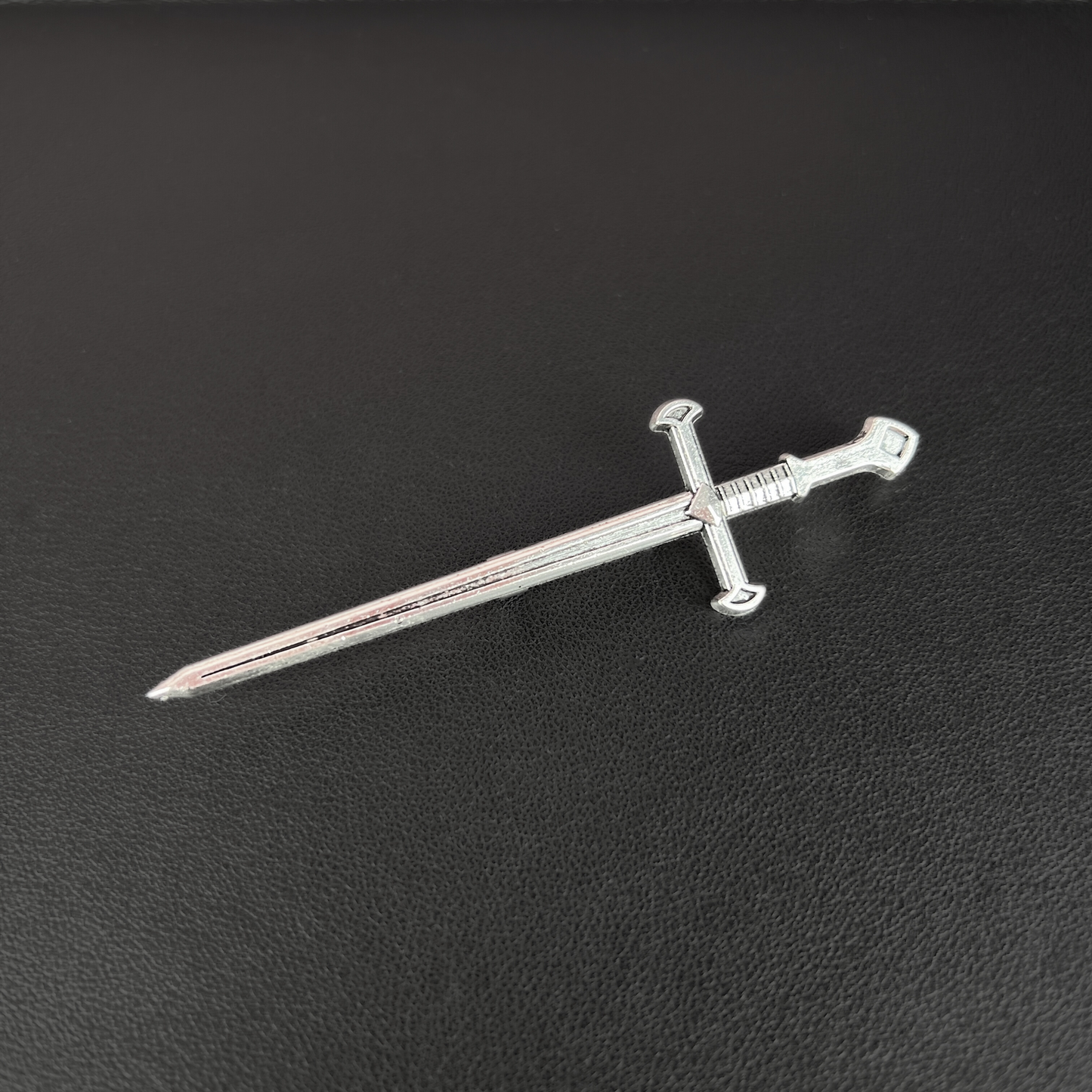 Medieval sword brooch