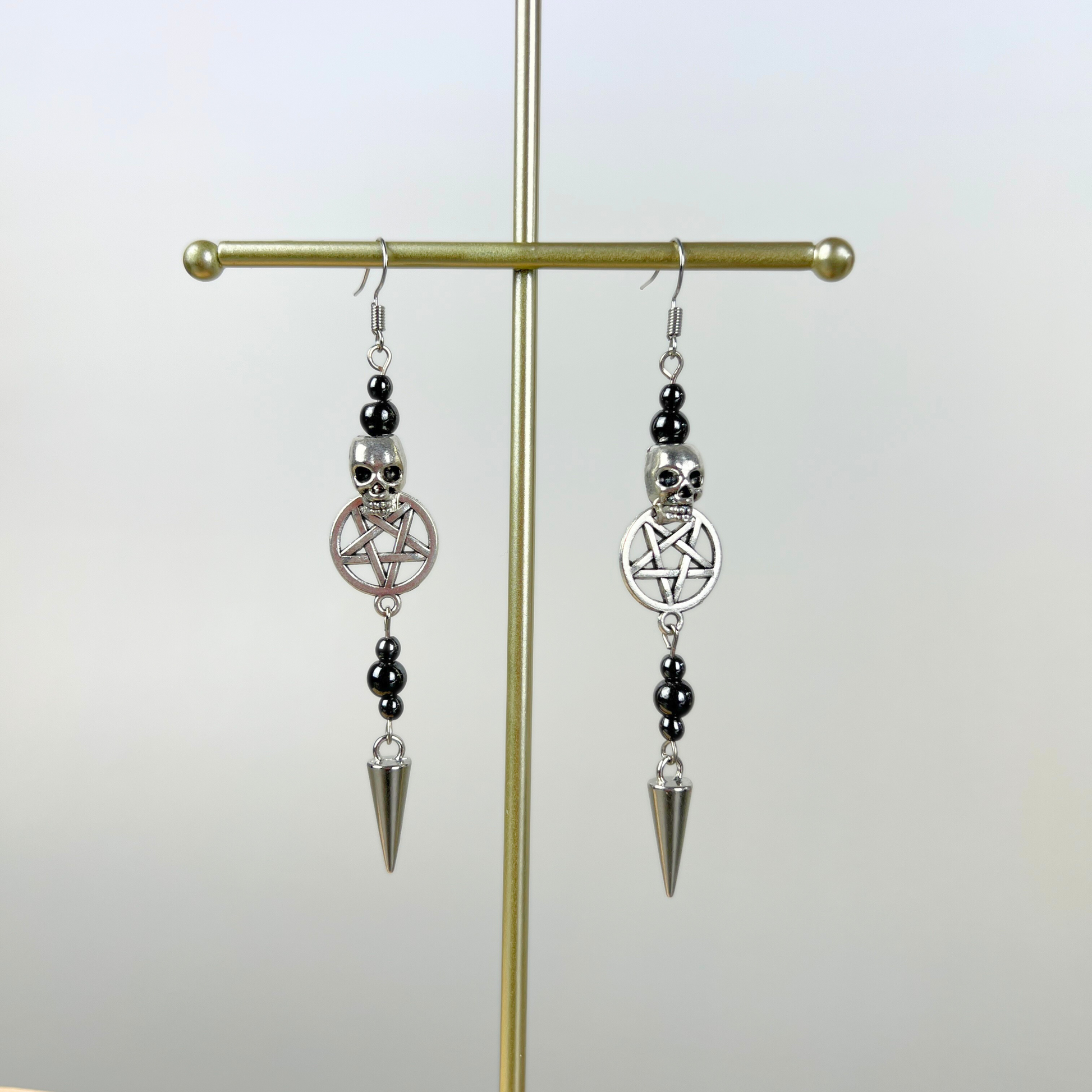 Skulls pentacles spikes and magnetic hematite earrings Baguette Magick