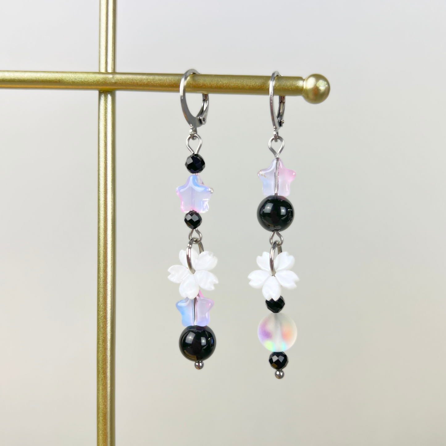 The Celestial Nocture earrings: Rainbow Obsisidan, Onyx, Holo glass, stars and Sakura flowers Baguette Magick