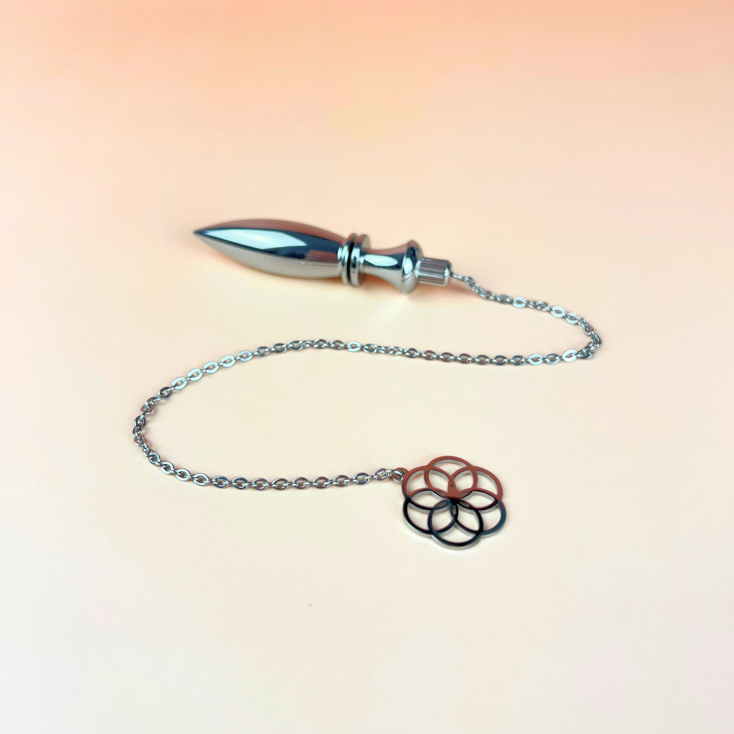 Metal Thot pendulum with a flower of life symbol Baguette Magick