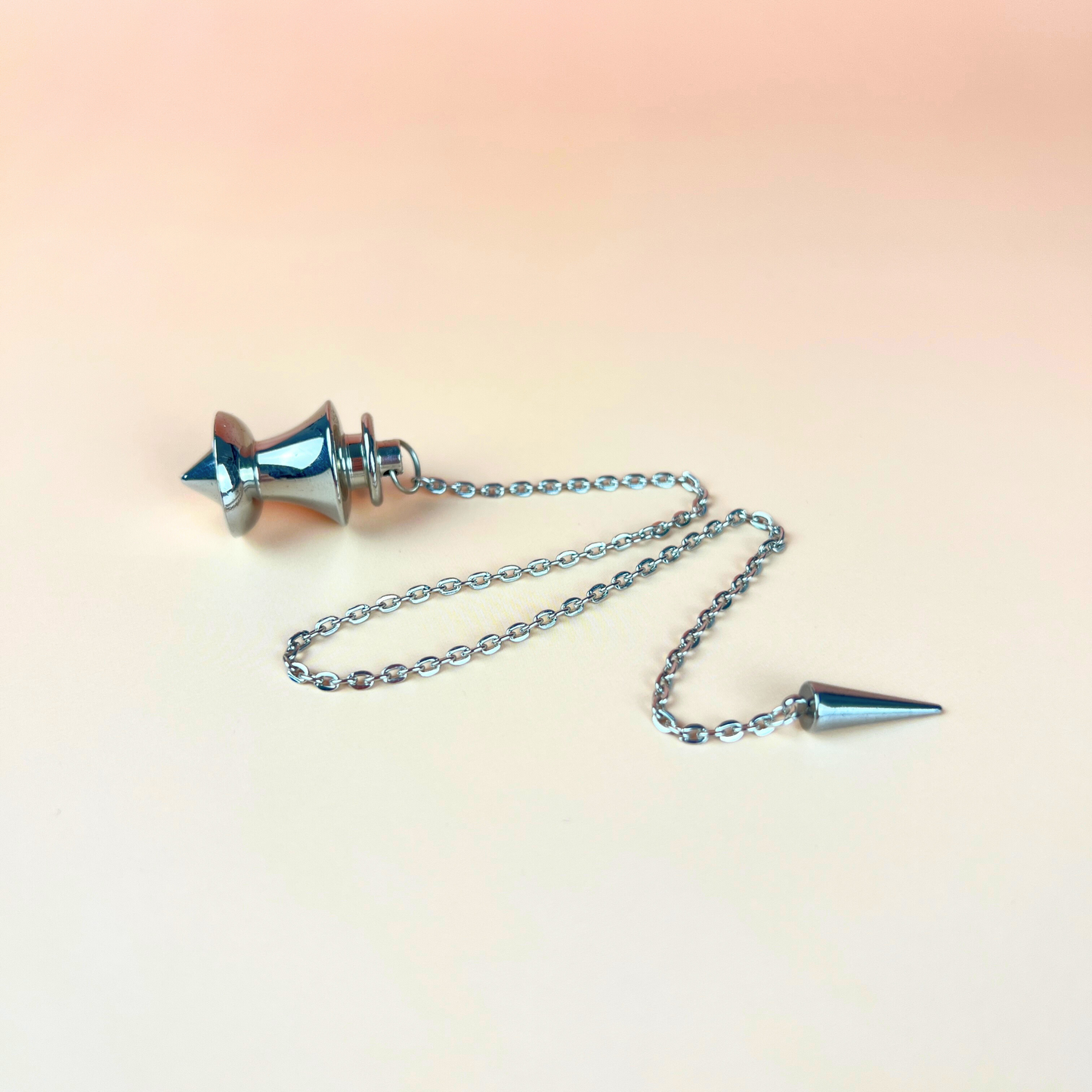 Point and dome dowsing metal pendulum with a spike charm Baguette Magick