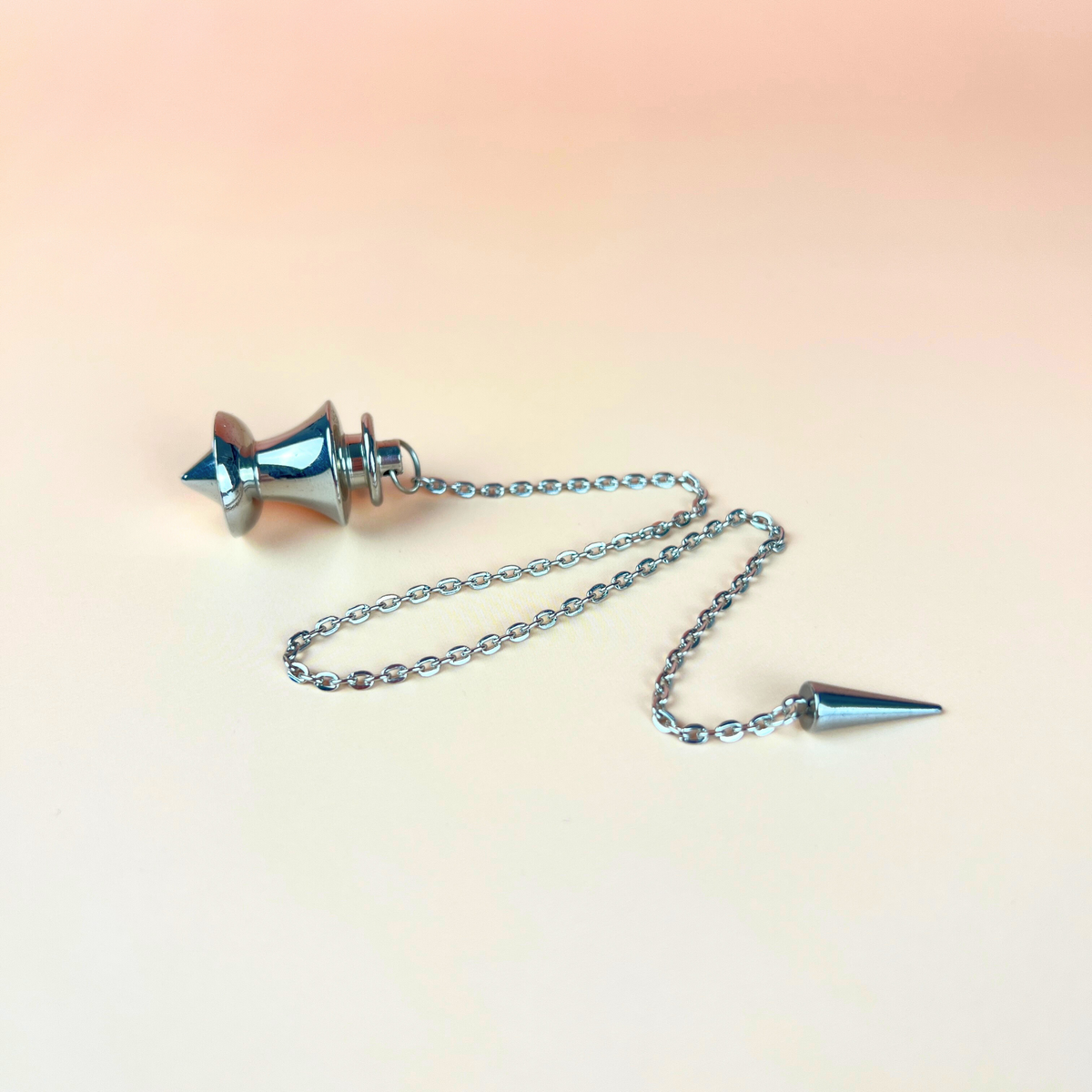 Point and dome dowsing metal pendulum with a spike charm Baguette Magick