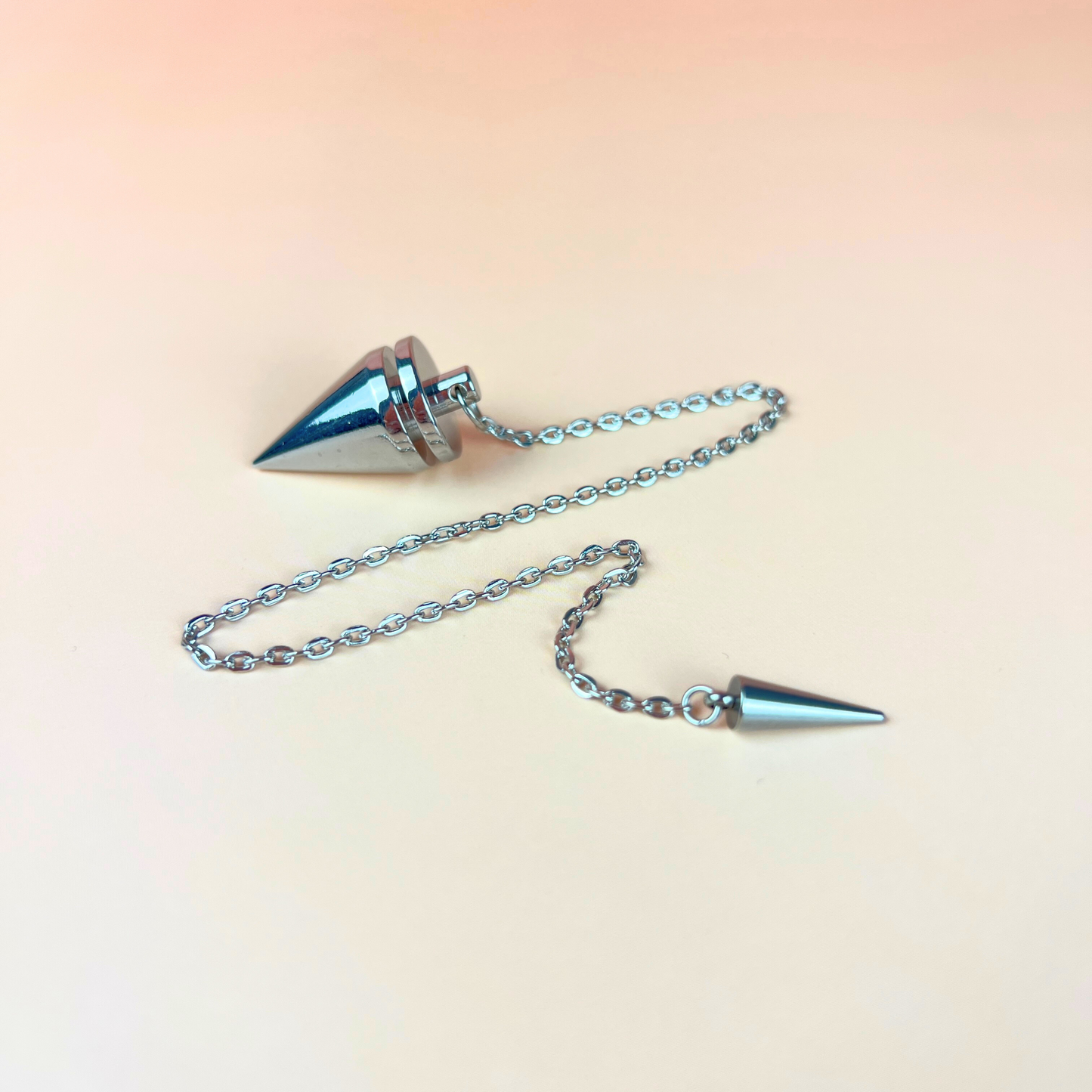 Cone and coil classic dowsing metal pendulum with a spike charm Baguette Magick