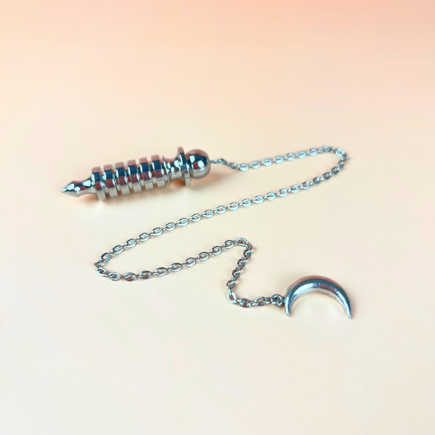 Egyptian Isis metal dowsing pendulum with a chamber and a Moon crescent Baguette Magick
