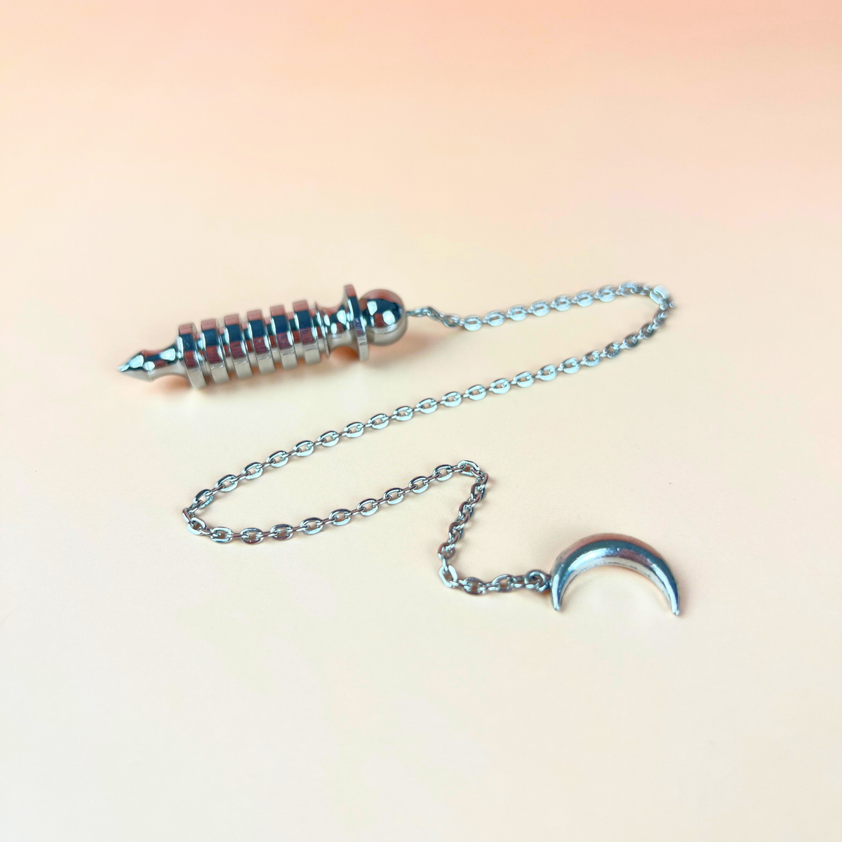 Egyptian Isis metal dowsing pendulum with a chamber and a Moon crescent Baguette Magick