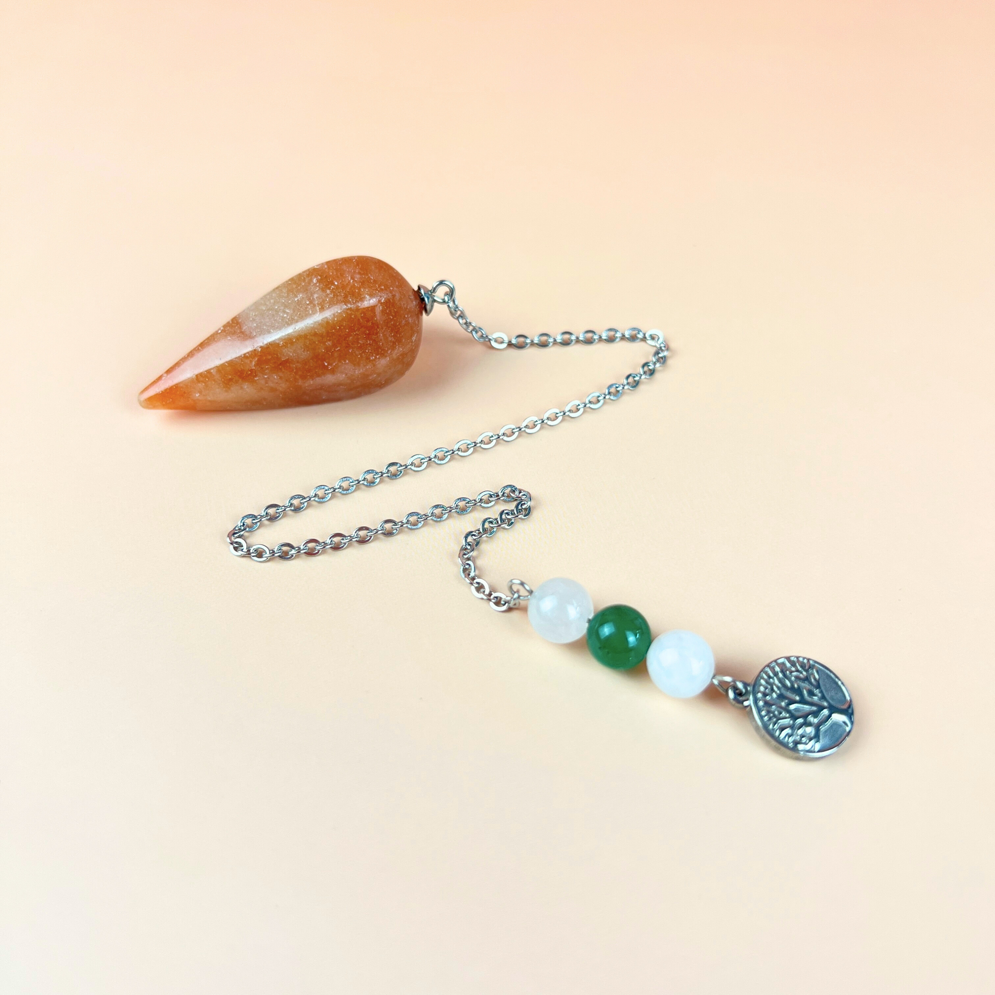 Orange and green aventurine, clear quartz, and tree of life pendulum Baguette Magick