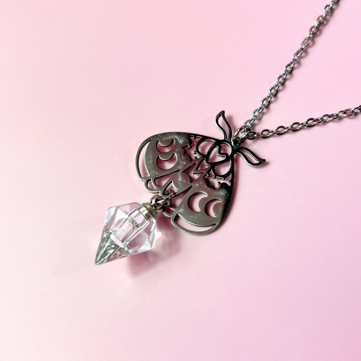 Moth potion necklace with moon phases