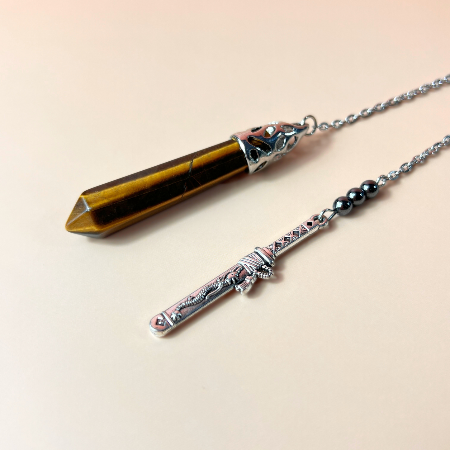 Tiger eye, hematite and tanto dagger pendulum