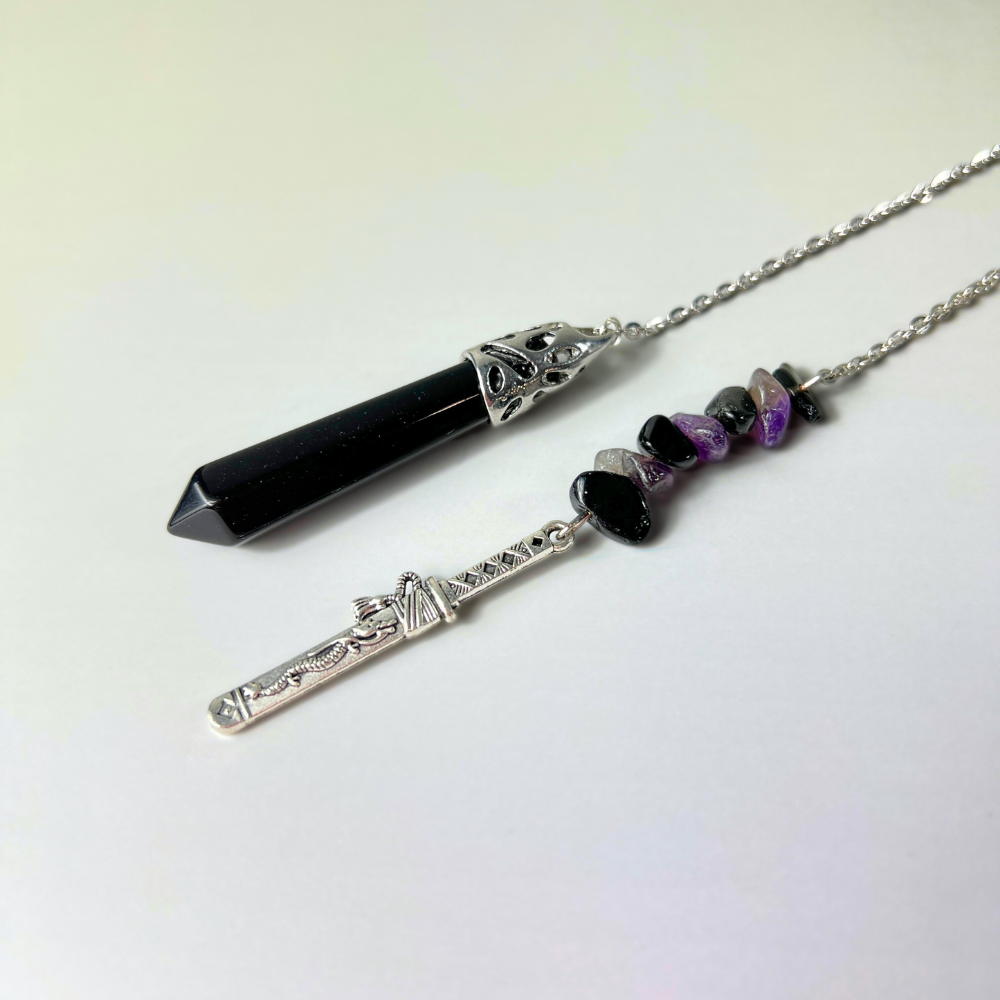 Onyx, obsidian and amethyst pendulum with a tanto dagger charm Baguette Magick