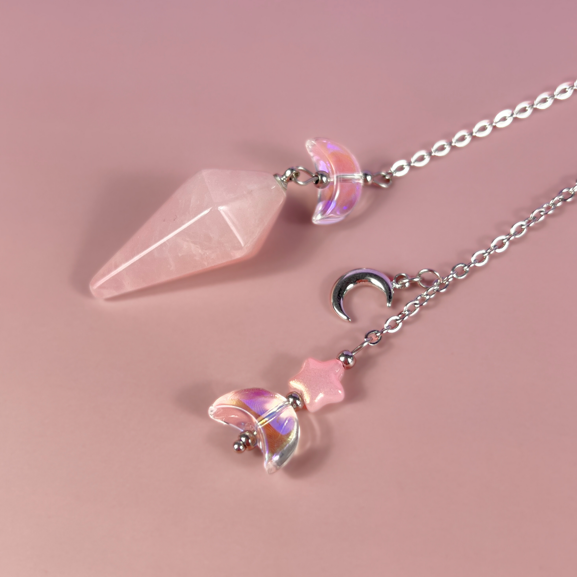 Celestial rose quartz dowsing pendulum, with moon & star charms Baguette Magick