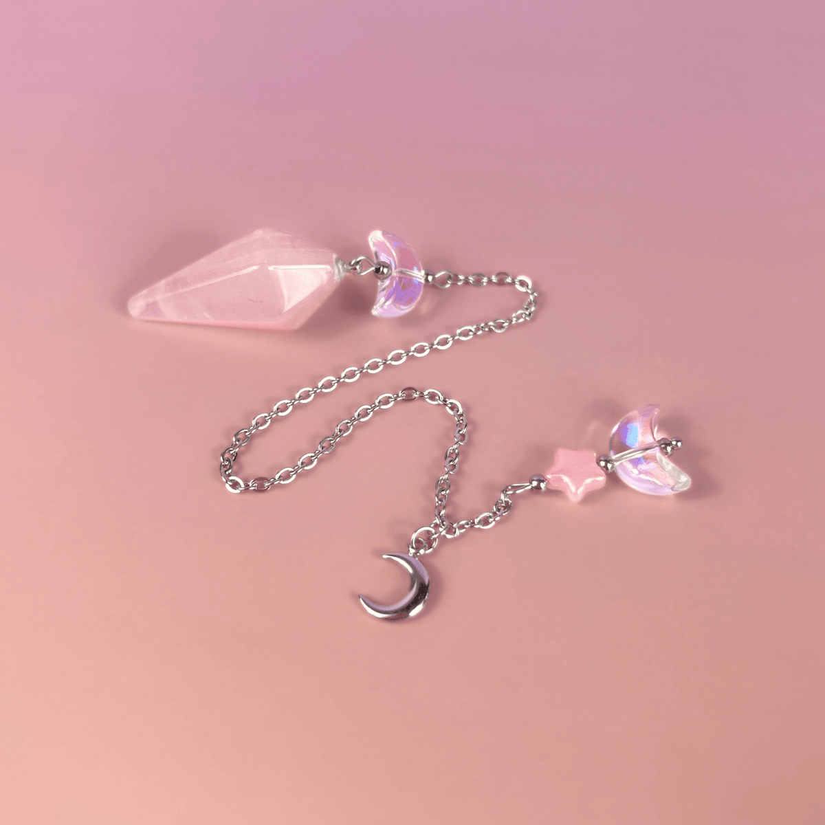 Celestial rose quartz dowsing pendulum, with moon & star charms Baguette Magick