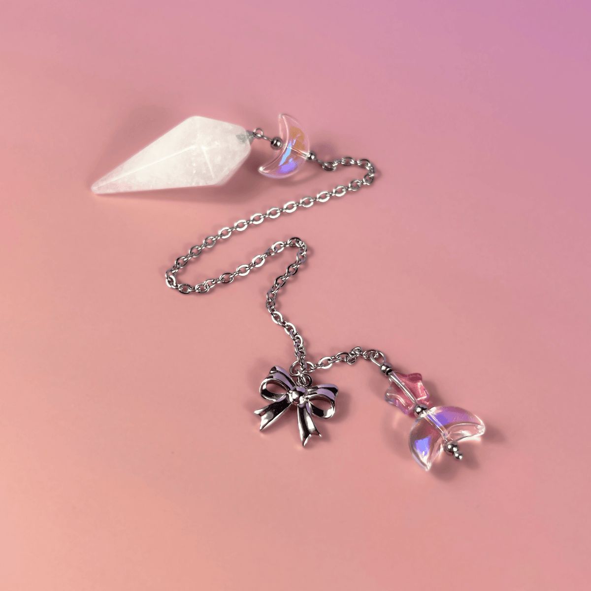 Celestial Clear Quartz dowsing pendulum, with moon, star & bow charms Baguette Magick