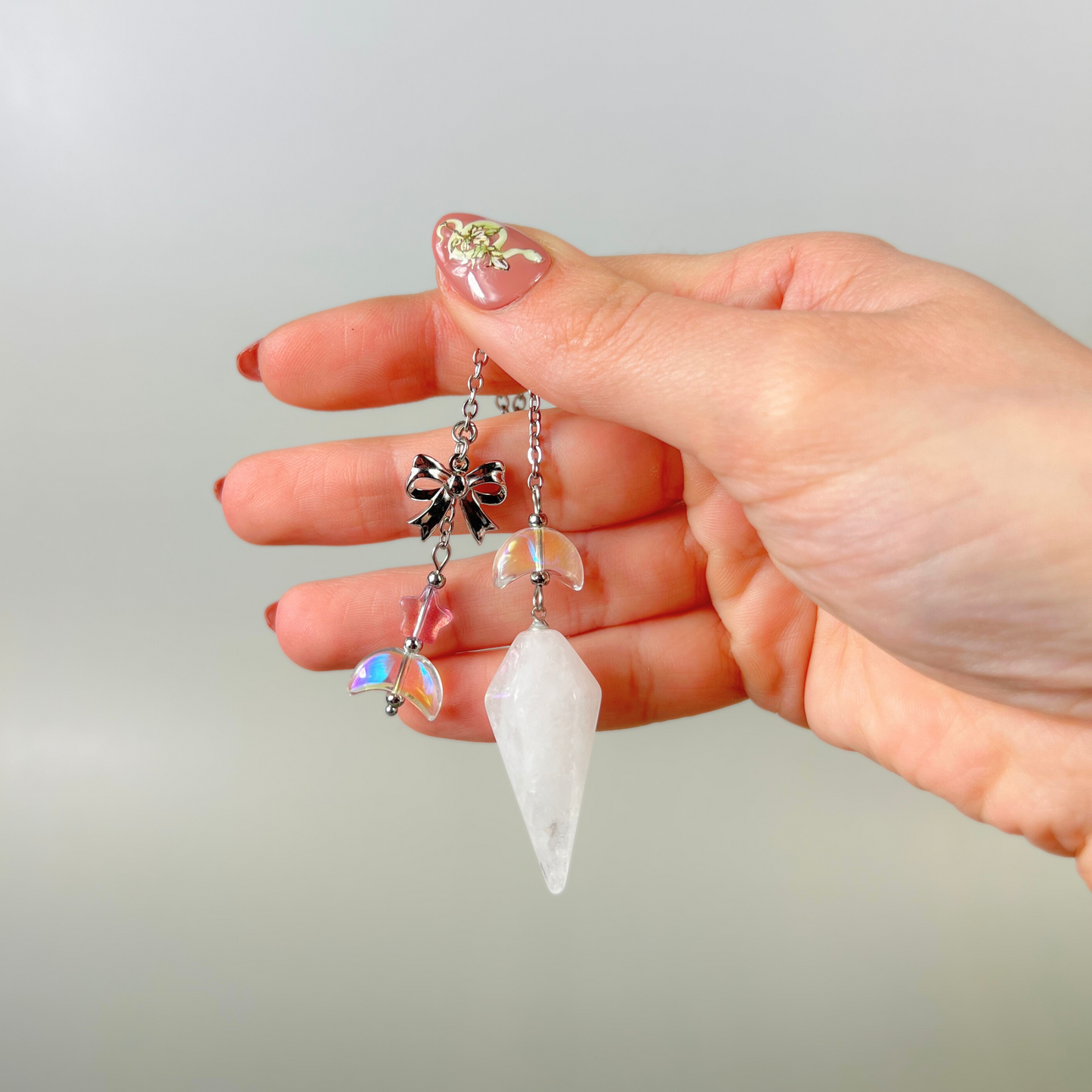 Celestial Clear Quartz dowsing pendulum, with moon, star & bow charms