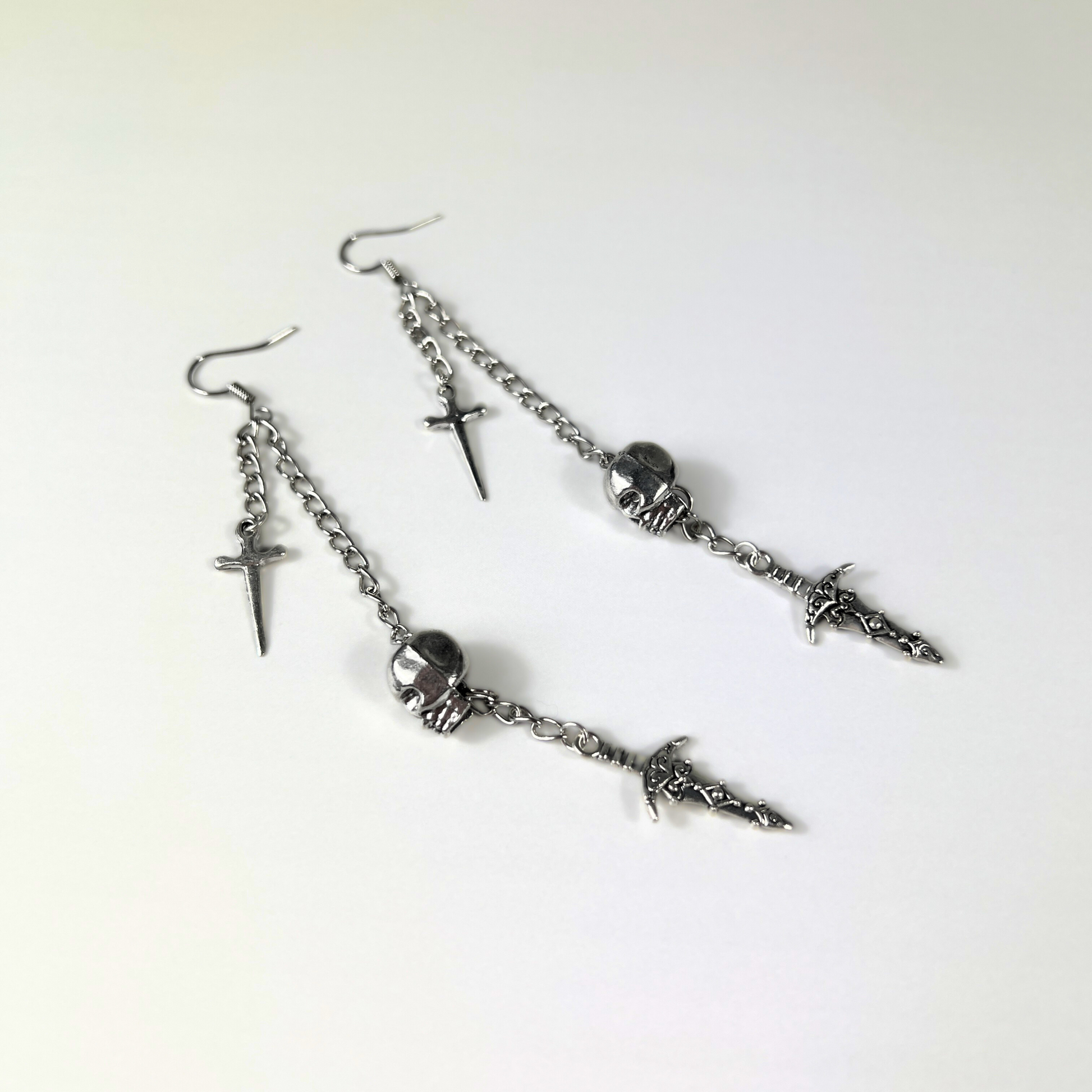 Skull and daggers dangle & drop earrings Baguette Magick
