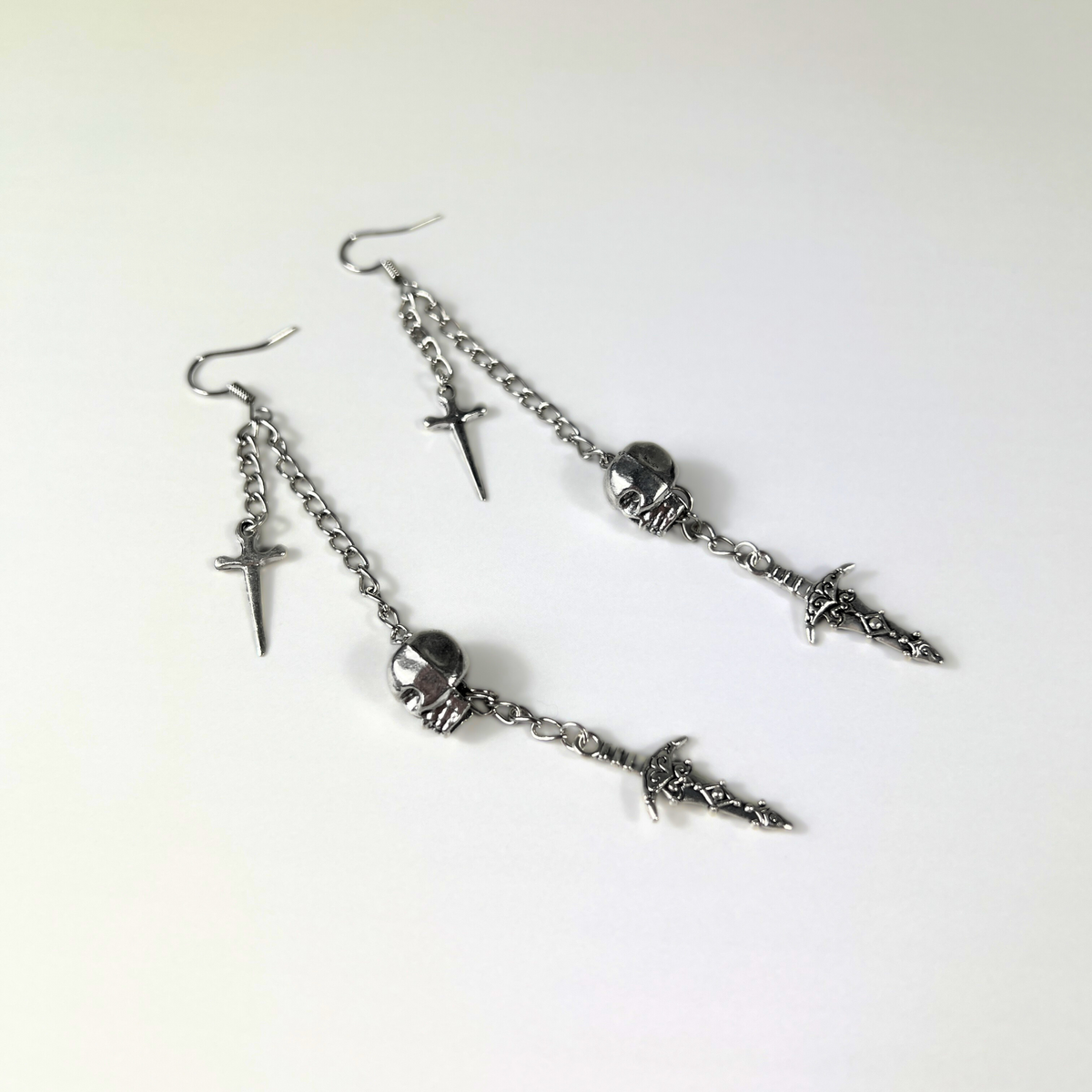 Skull and daggers dangle & drop earrings Baguette Magick