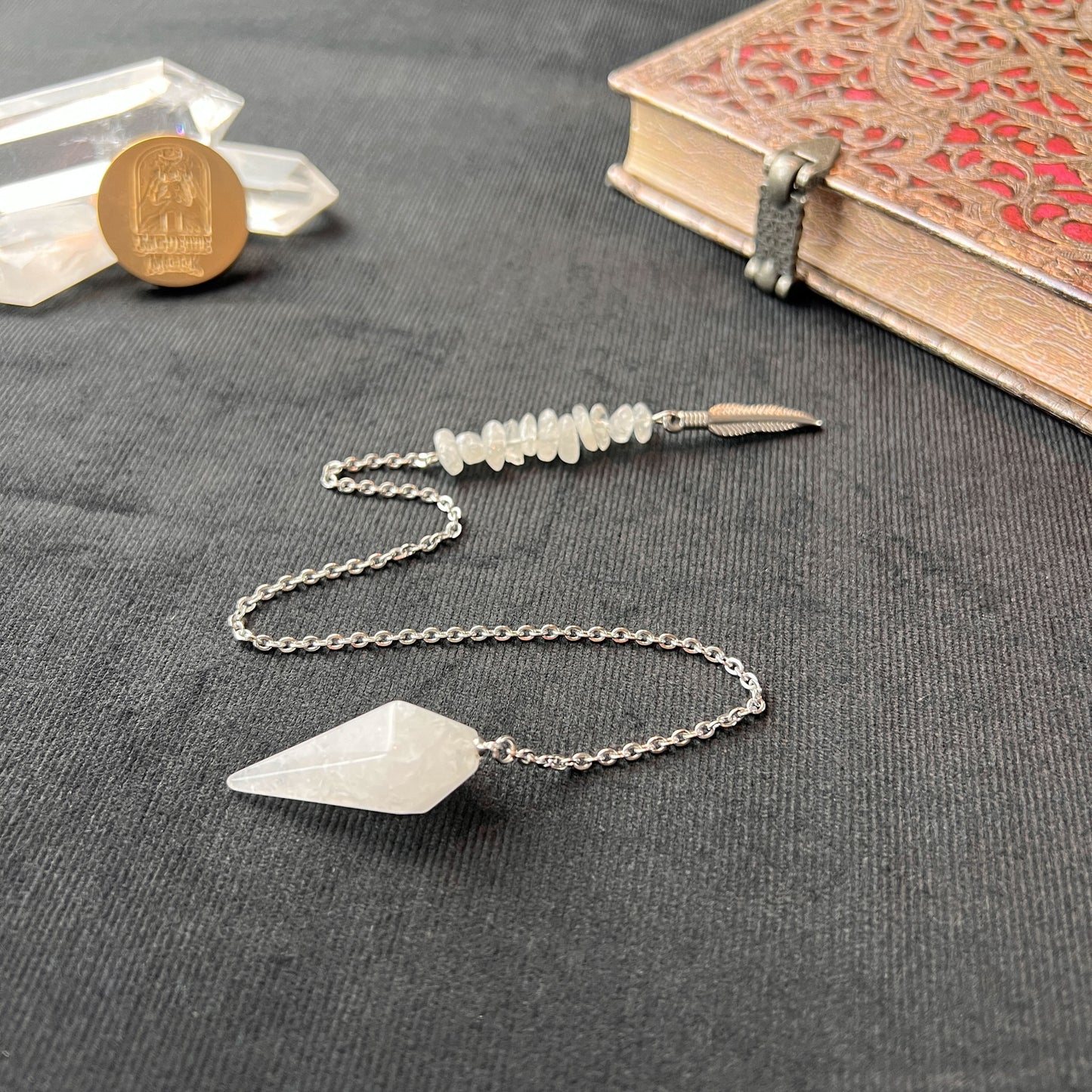 clear quartz gemstone crystal dowsing pendulum feather charm witchcraft altar pagan tool baguette magick