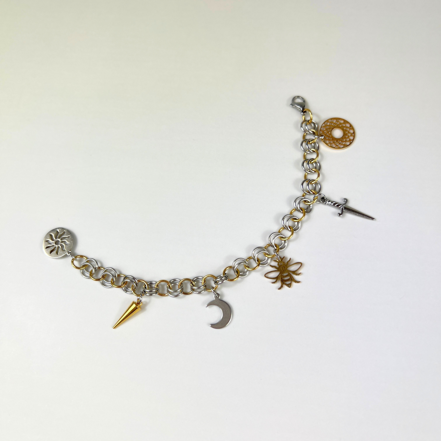 Chainmail charm bracelet, gold and silver tones