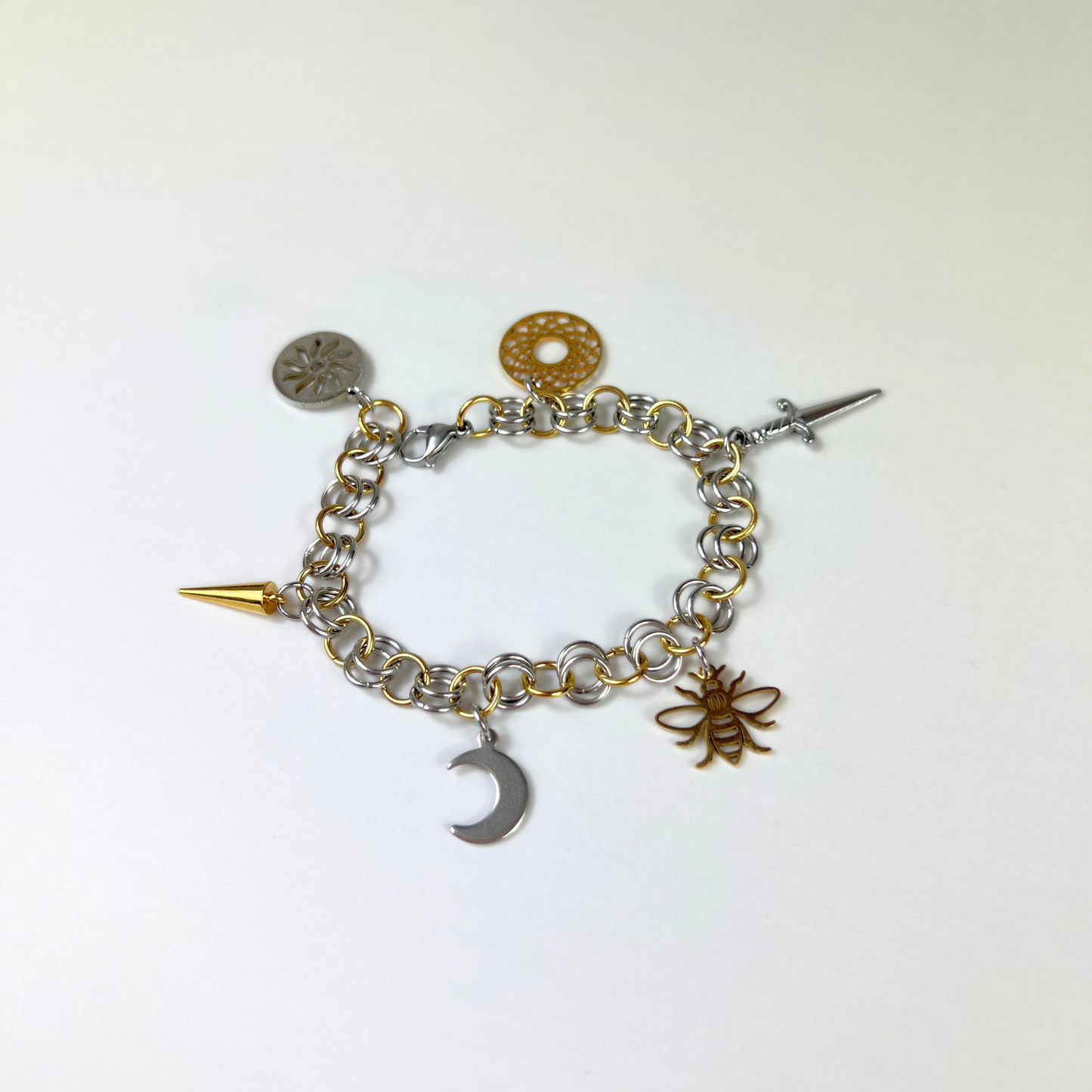 Chainmail charm bracelet, gold and silver tones
