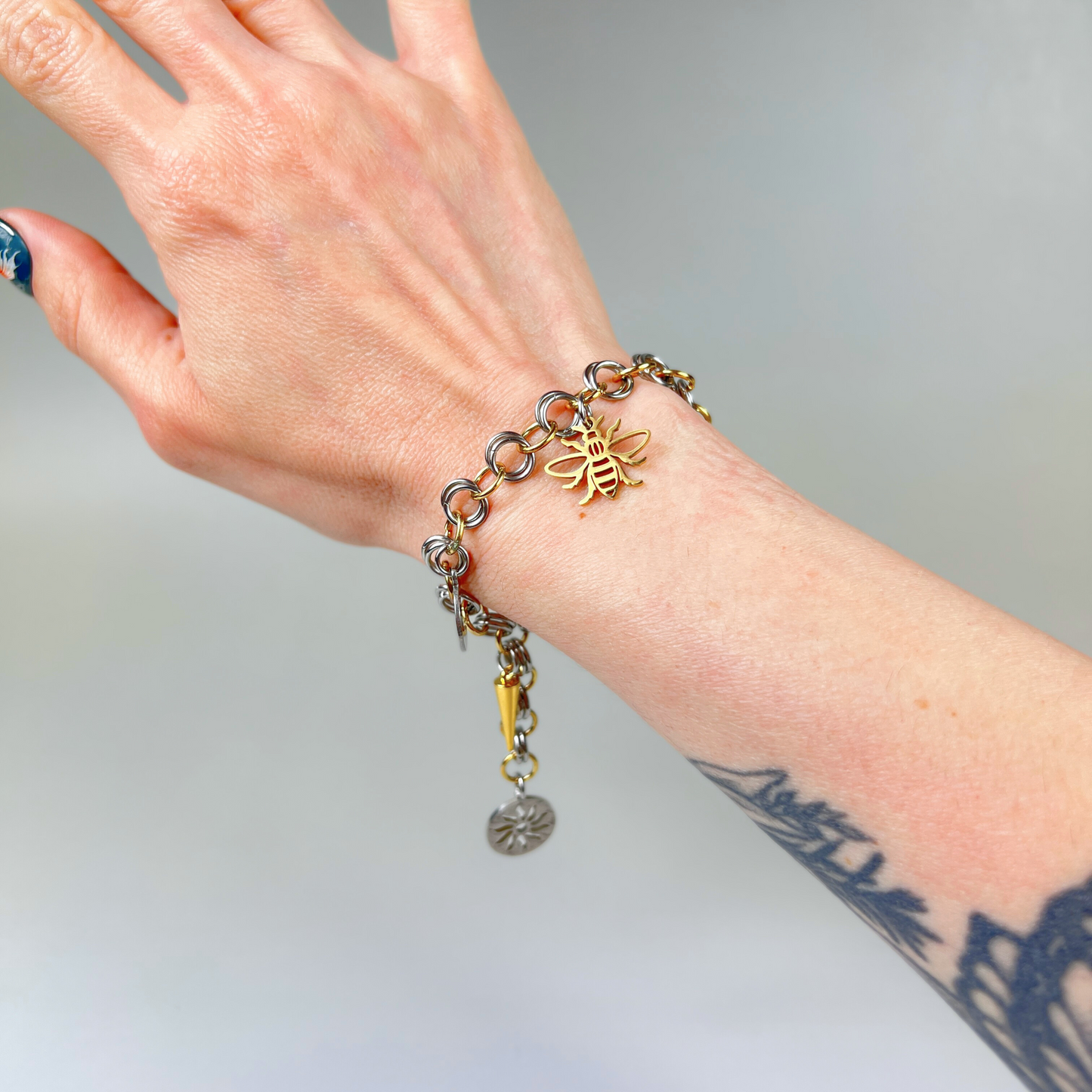 Chainmail charm bracelet, gold and silver tones