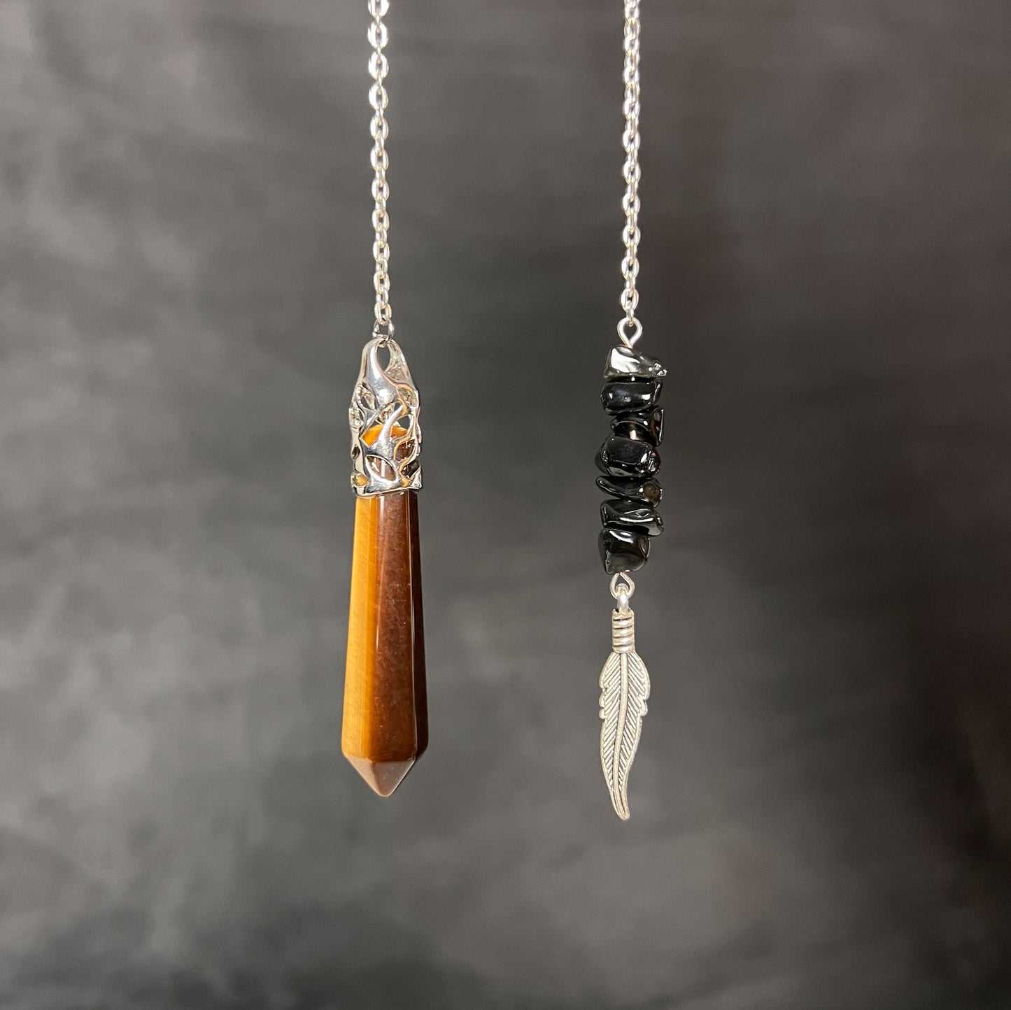 Tiger eye, obsidian and feather pendulum Baguette Magick