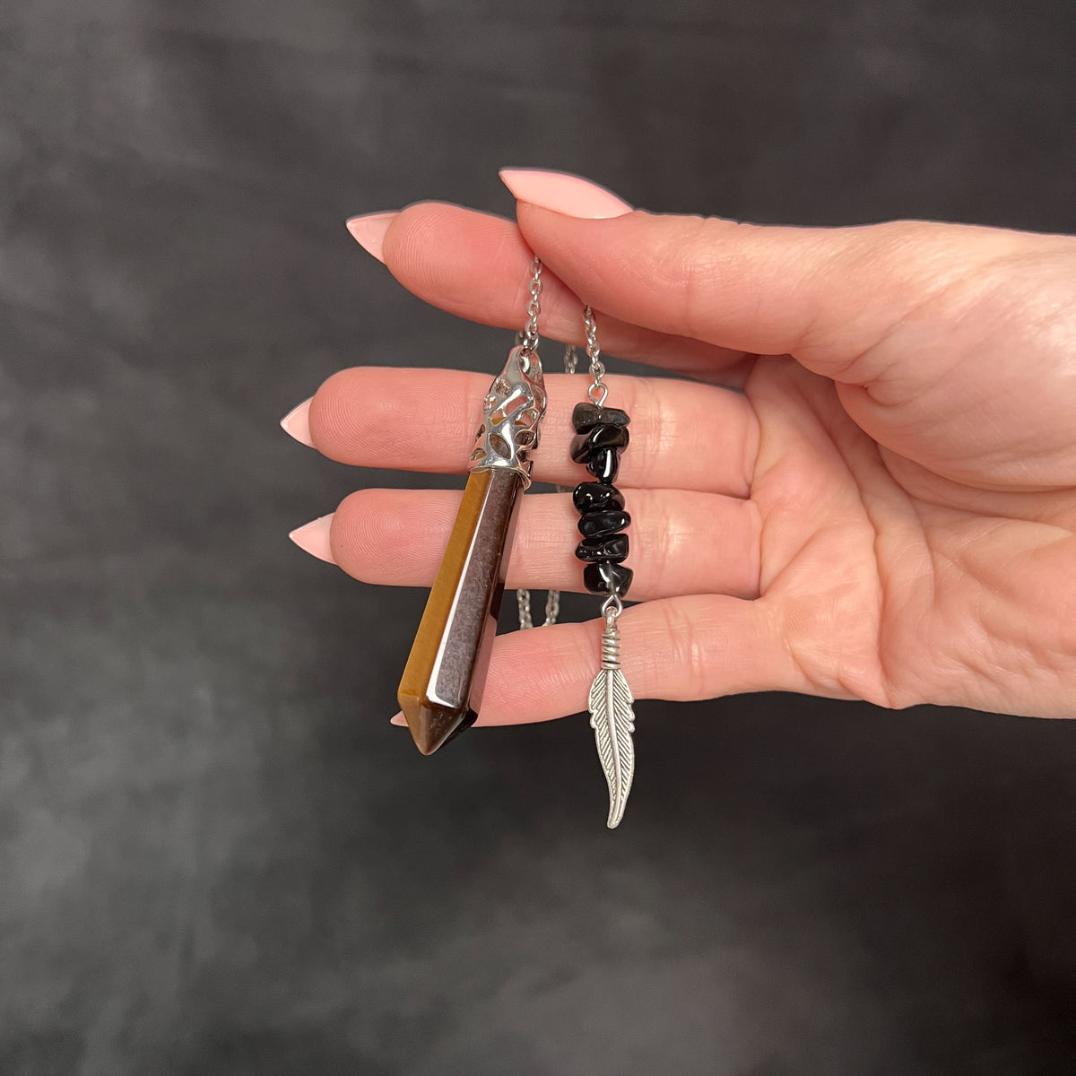Tiger eye, obsidian and feather pendulum Baguette Magick