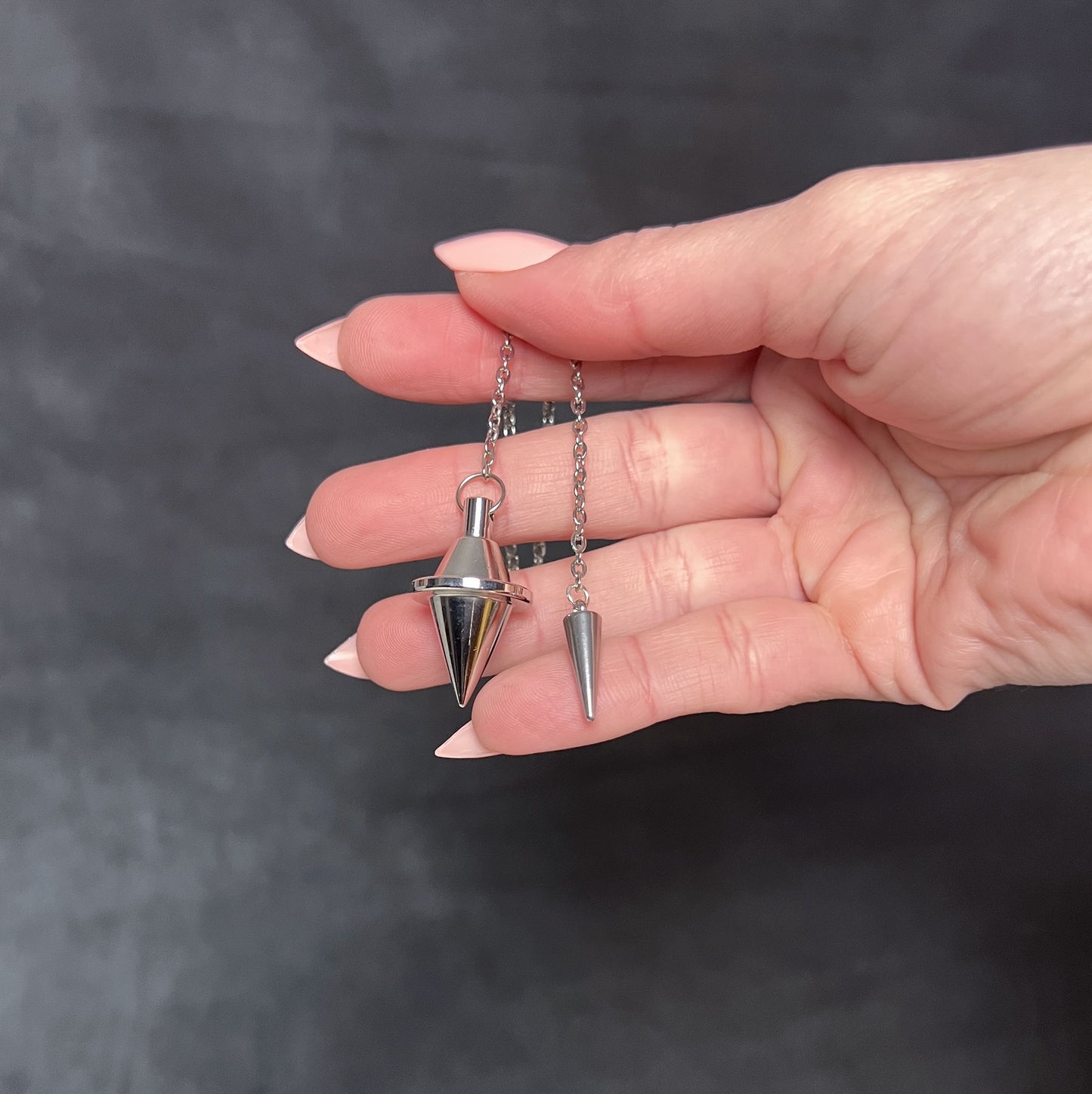 Silver-tone double cone pendulum with a spike charm Baguette Magick