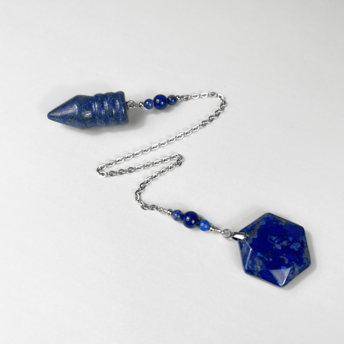 Bullet-shaped Lapis Lazuli pendulum, with a hexagonal gem