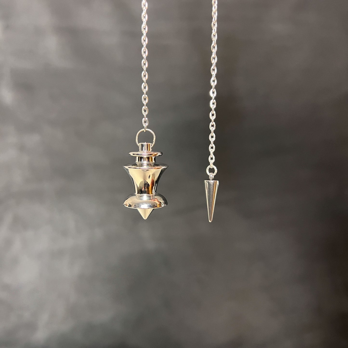 Point and dome dowsing metal pendulum with a spike charm Baguette Magick