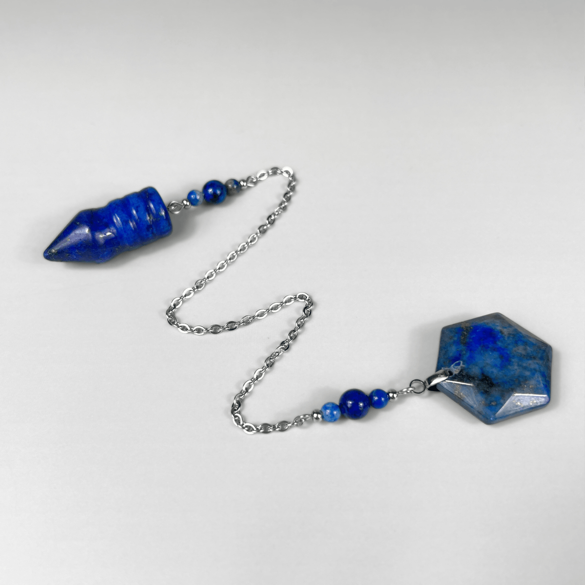 Bullet-shaped Lapis Lazuli pendulum, with a hexagonal gem
