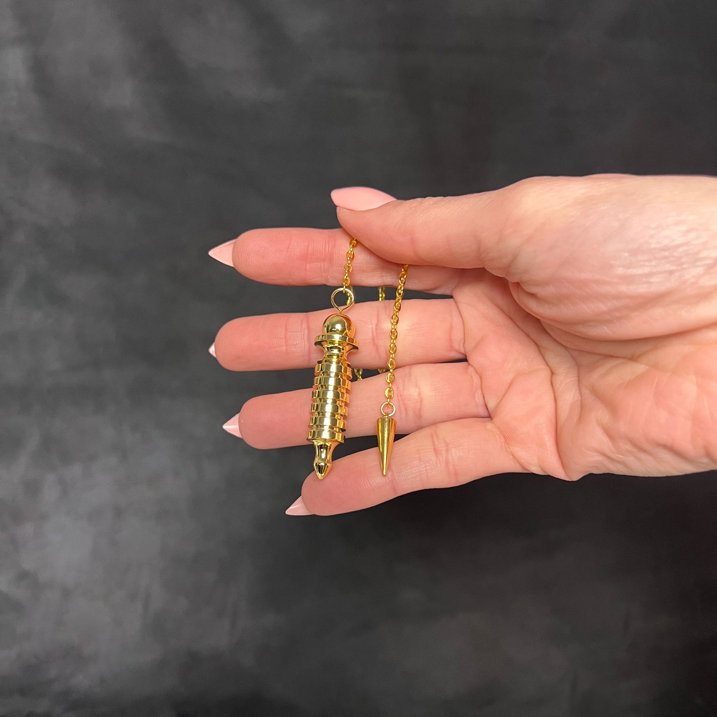Golden Egyptian Isis dowsing pendulum with a chamber Baguette Magick