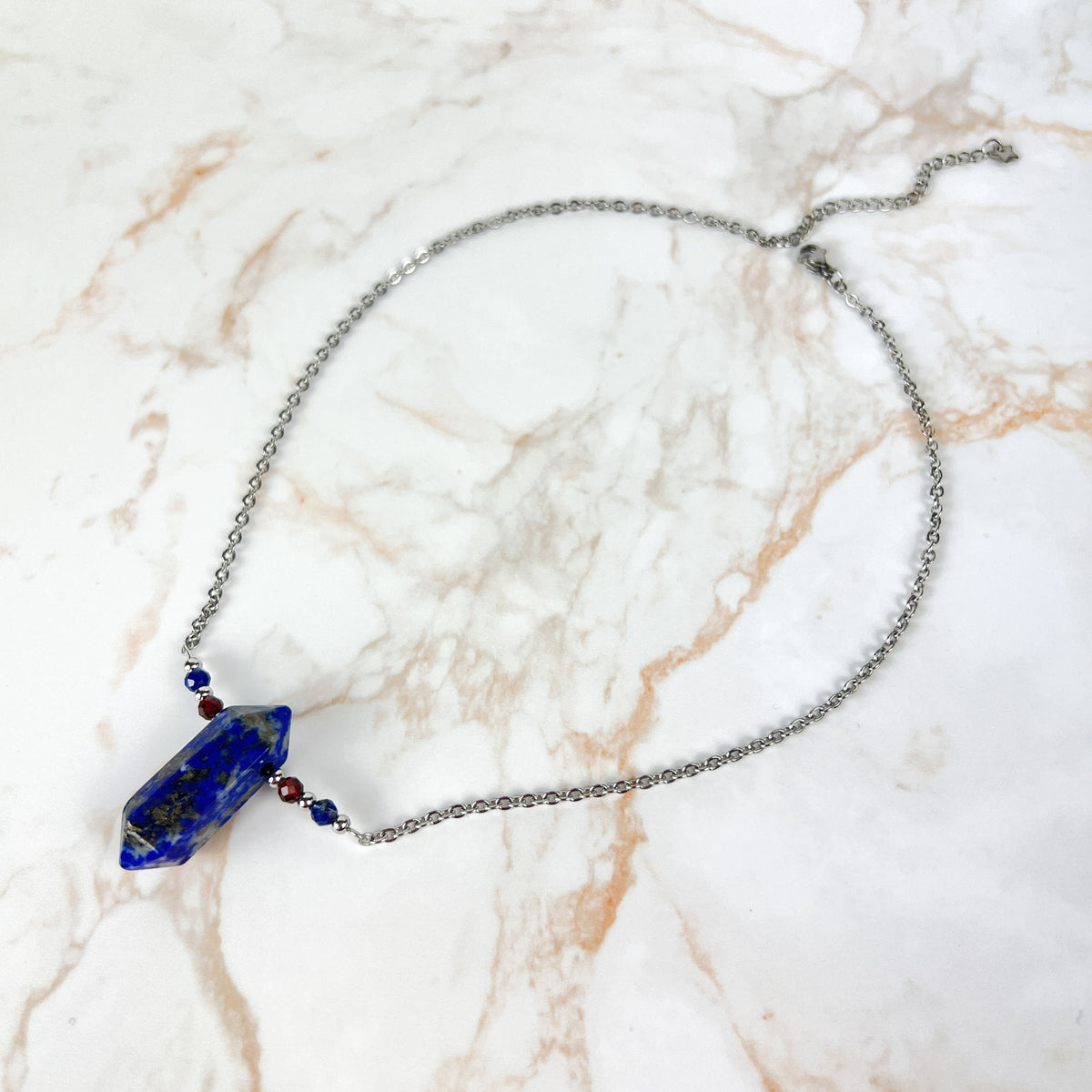 Lapis lazuli, garnet and stainless steel necklace with faceted beads Baguette Magick