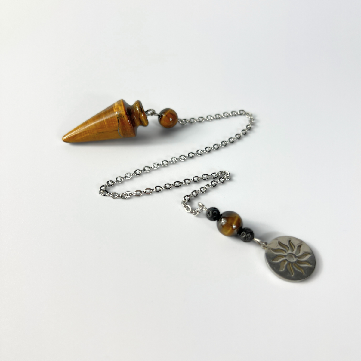 Tiger eye pendulum with a Sun charm