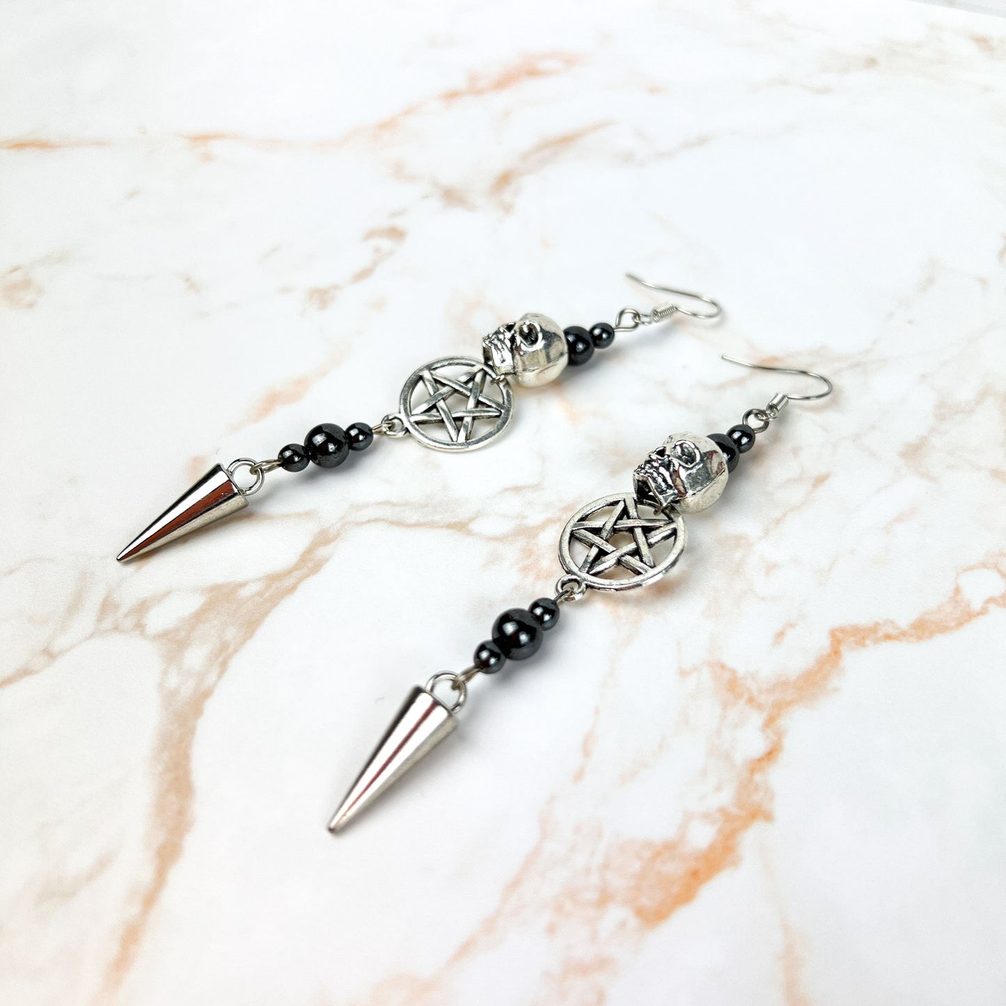 Skulls pentacles spikes and magnetic hematite earrings Baguette Magick