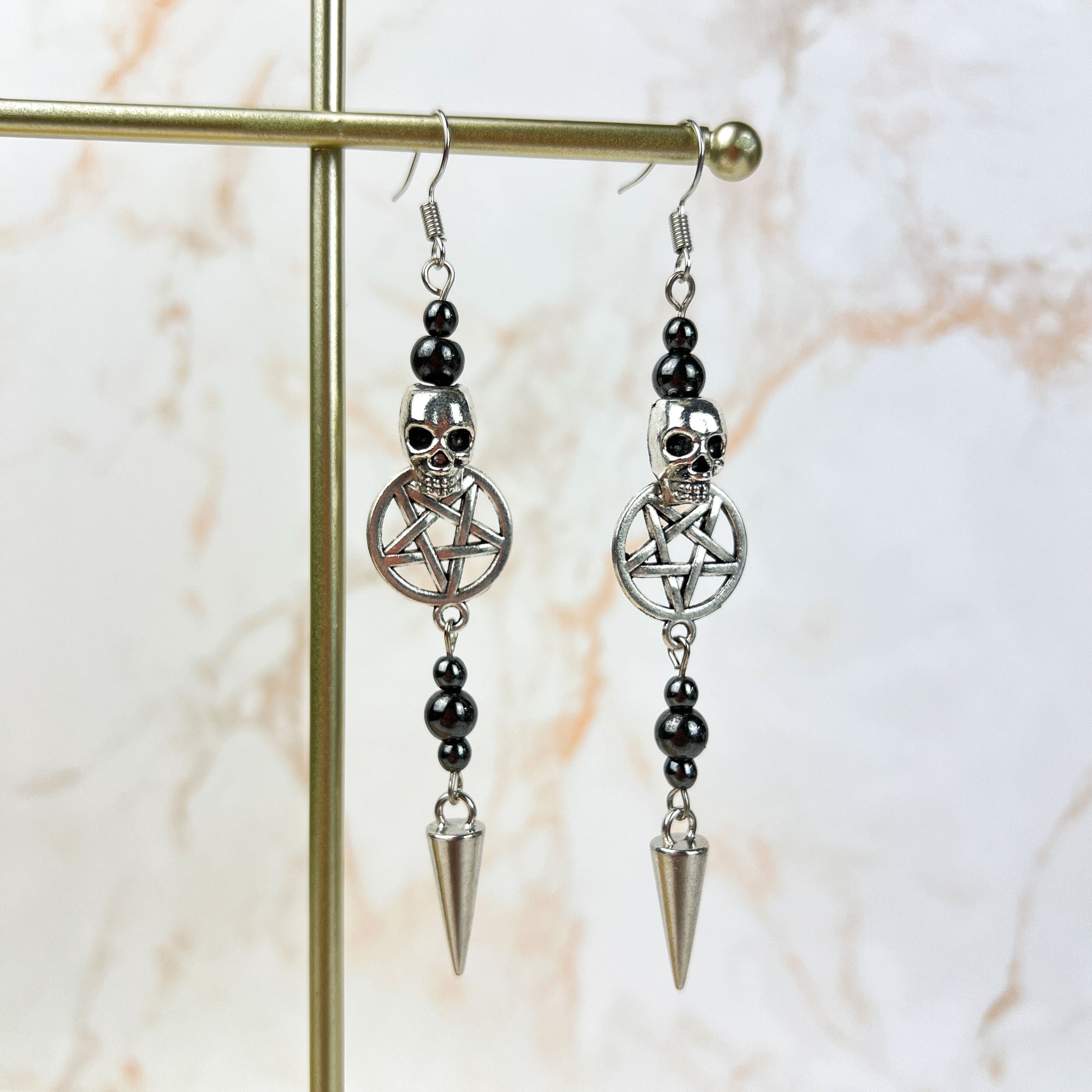 Skulls pentacles spikes and magnetic hematite earrings Baguette Magick
