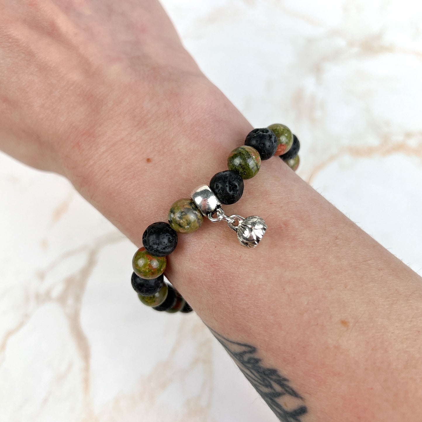 Unakite and lava mala beaded bracelet with a lotus seed charm Baguette Magick