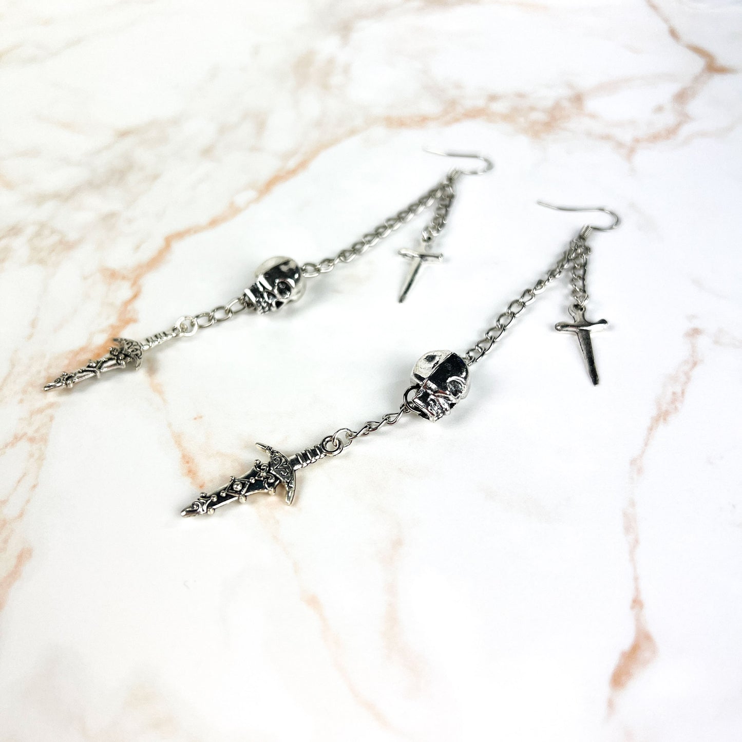 Skull and daggers dangle & drop earrings Baguette Magick