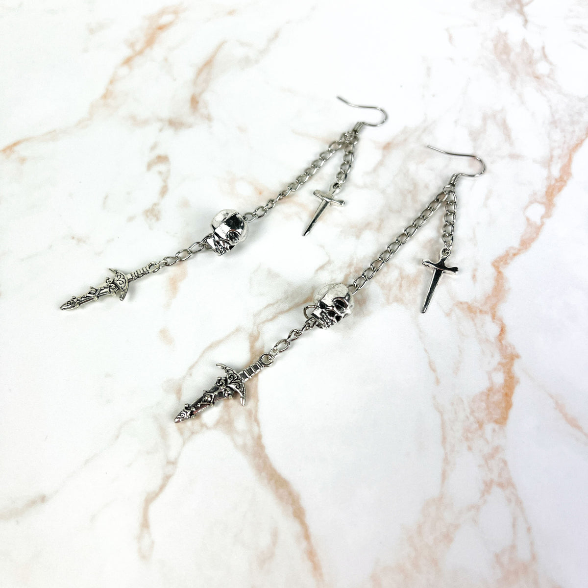 Skull and daggers dangle & drop earrings Baguette Magick