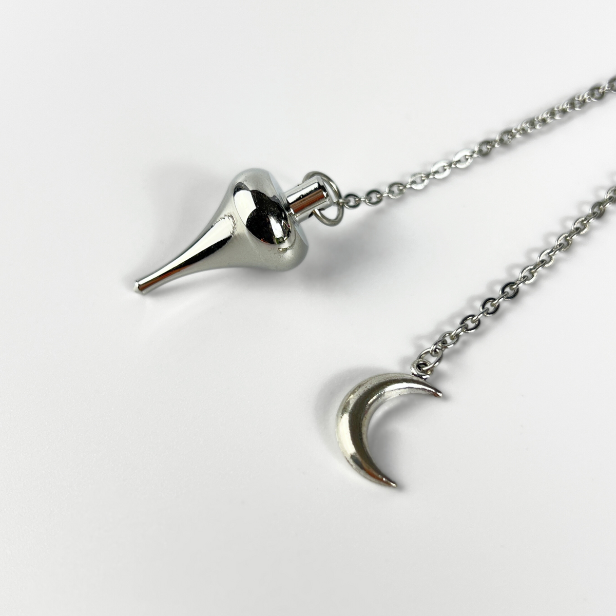 Luzi dowsing metal pendulum with a crescent Moon